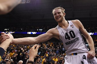Luke Fischer celebrates Marquette's big win over Villanova.