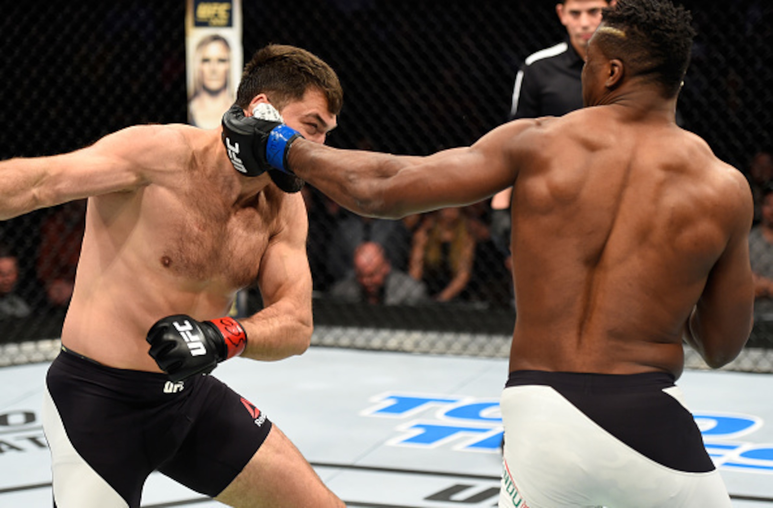 Francis Ngannou (right) punches Andrei Arlovski