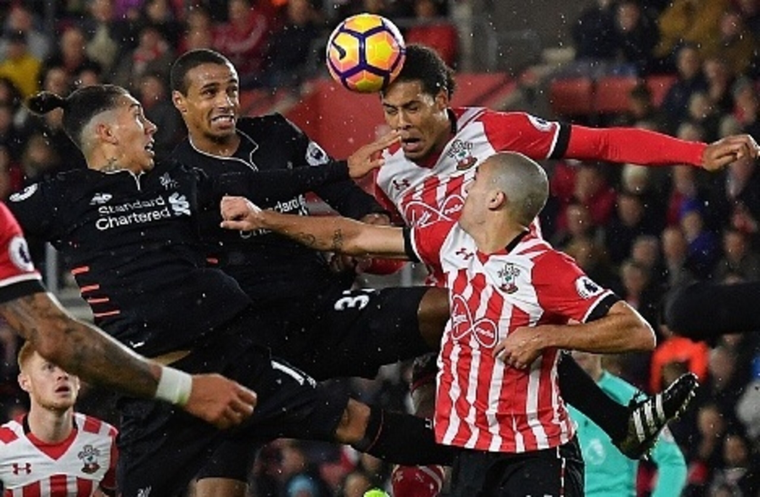 Liverpool's Brazilian midfielder Roberto Firmino (L) and Liverpool's German-born Cameroonian defender Joel Matip (2L) vie in the air with Southampton's Dutch defender Virgil van Dijk (2R) and Southampton's Sepanish midfielder Oriol Romeu during the Englis