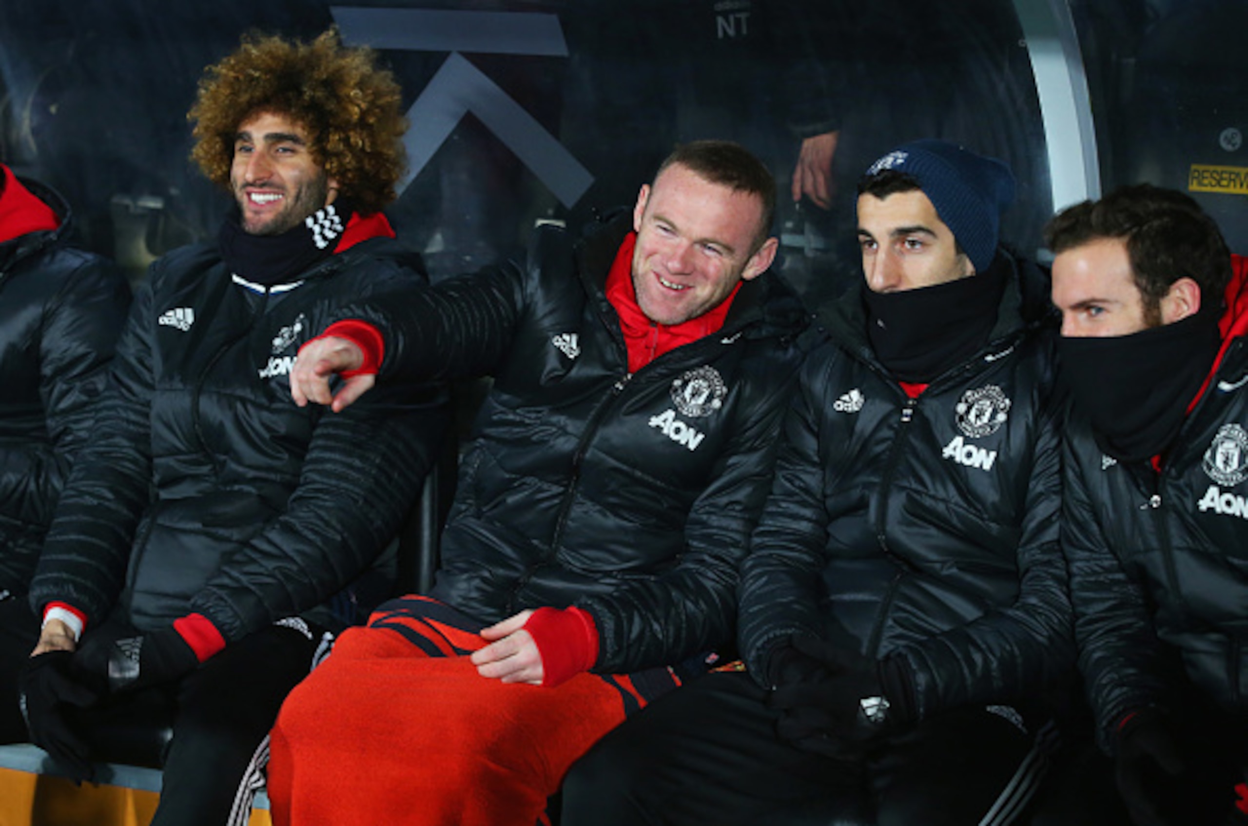 Rooney shares a chuckle on the United bench.