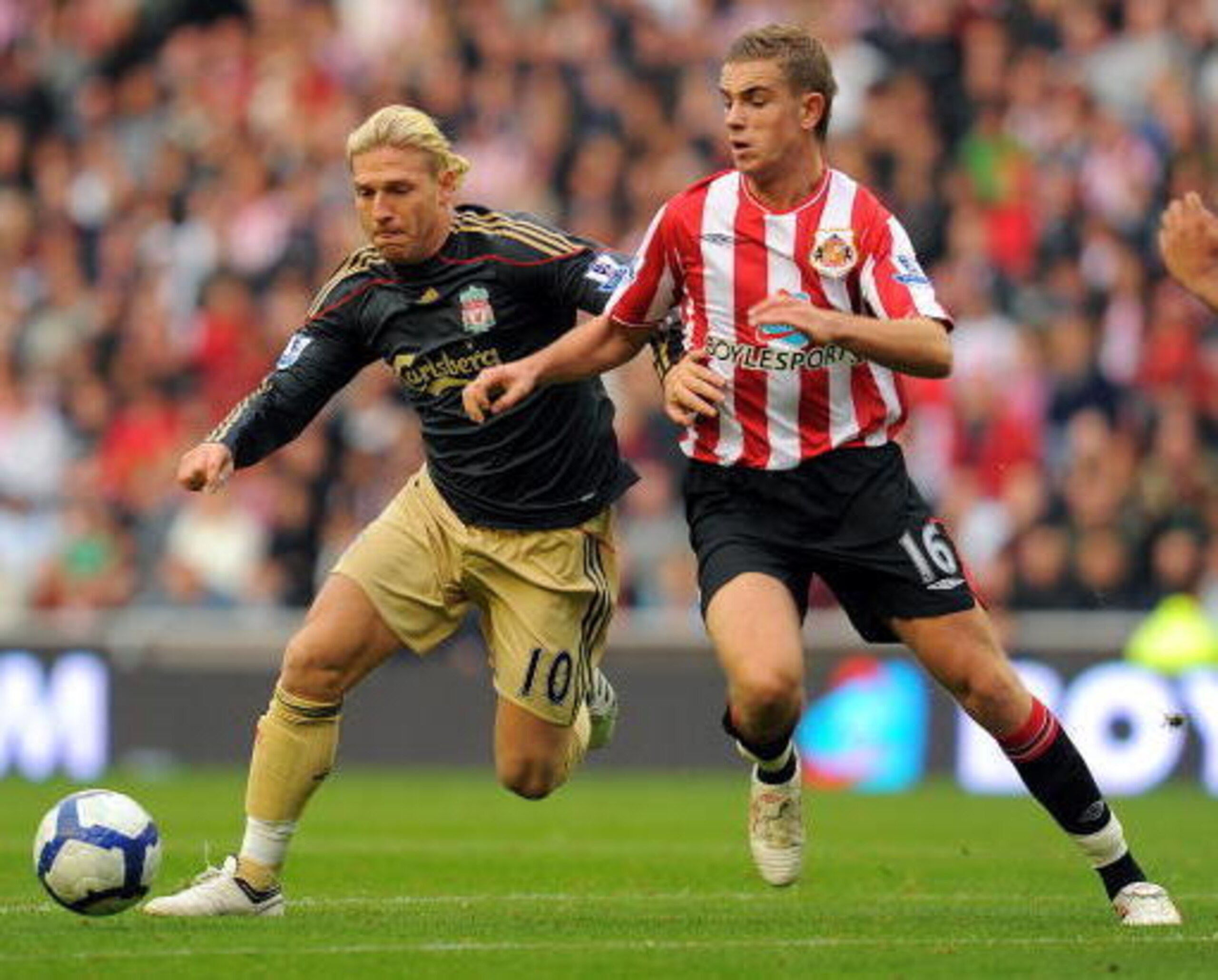 Future Liverpool captain Jordan Henderson (right) tussles with Triple H-lookalike Andriy Voronin.