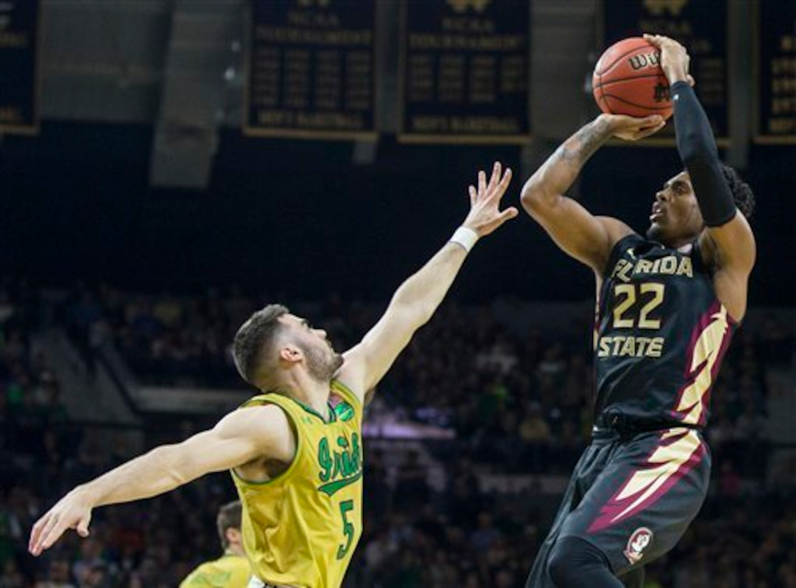 Xavier Rathan-Mayes (right) shoots over Matt Farrell.