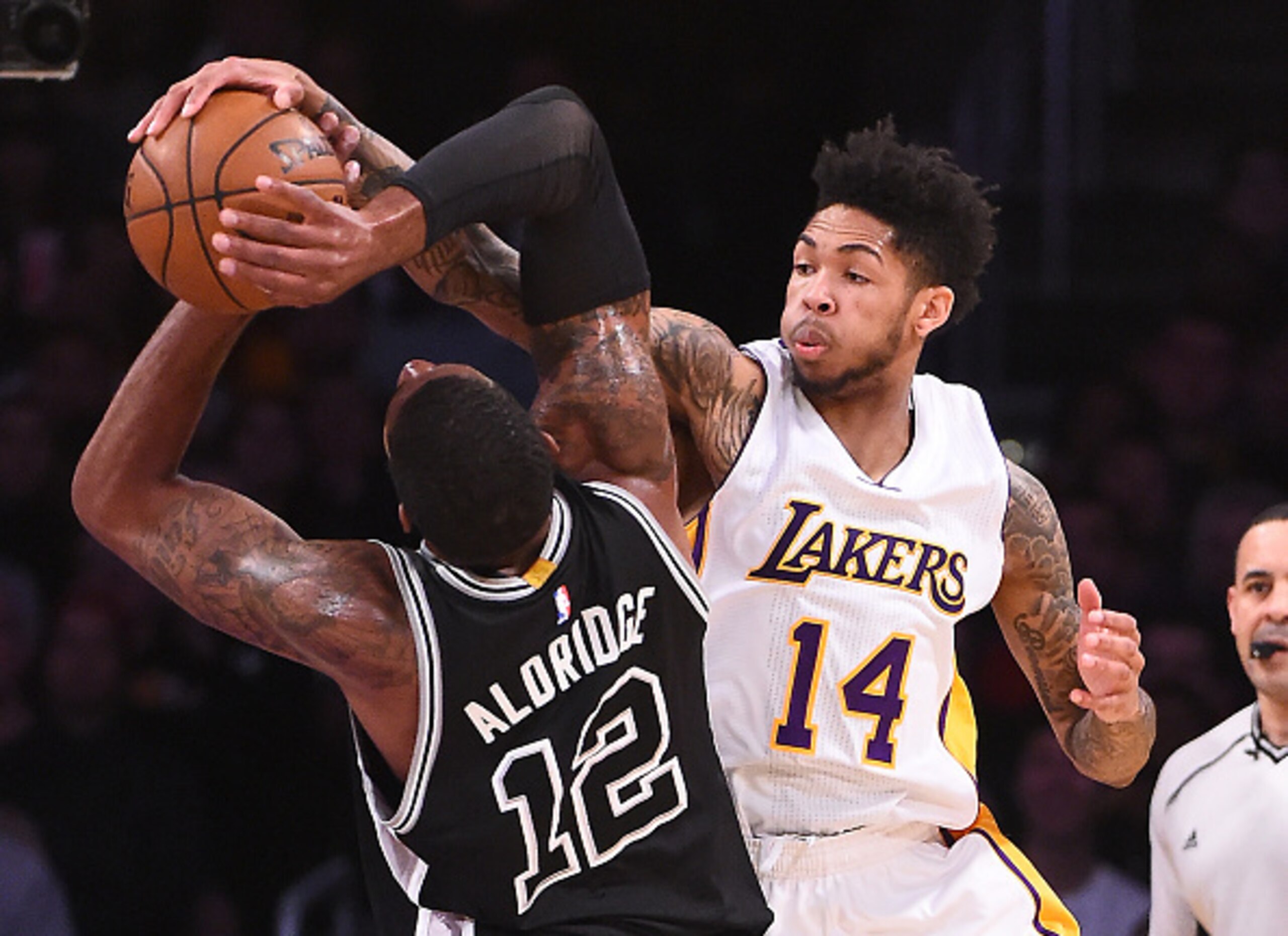 Rookie Brandon Ingram battles the Spurs' LaMarcus Aldridge.