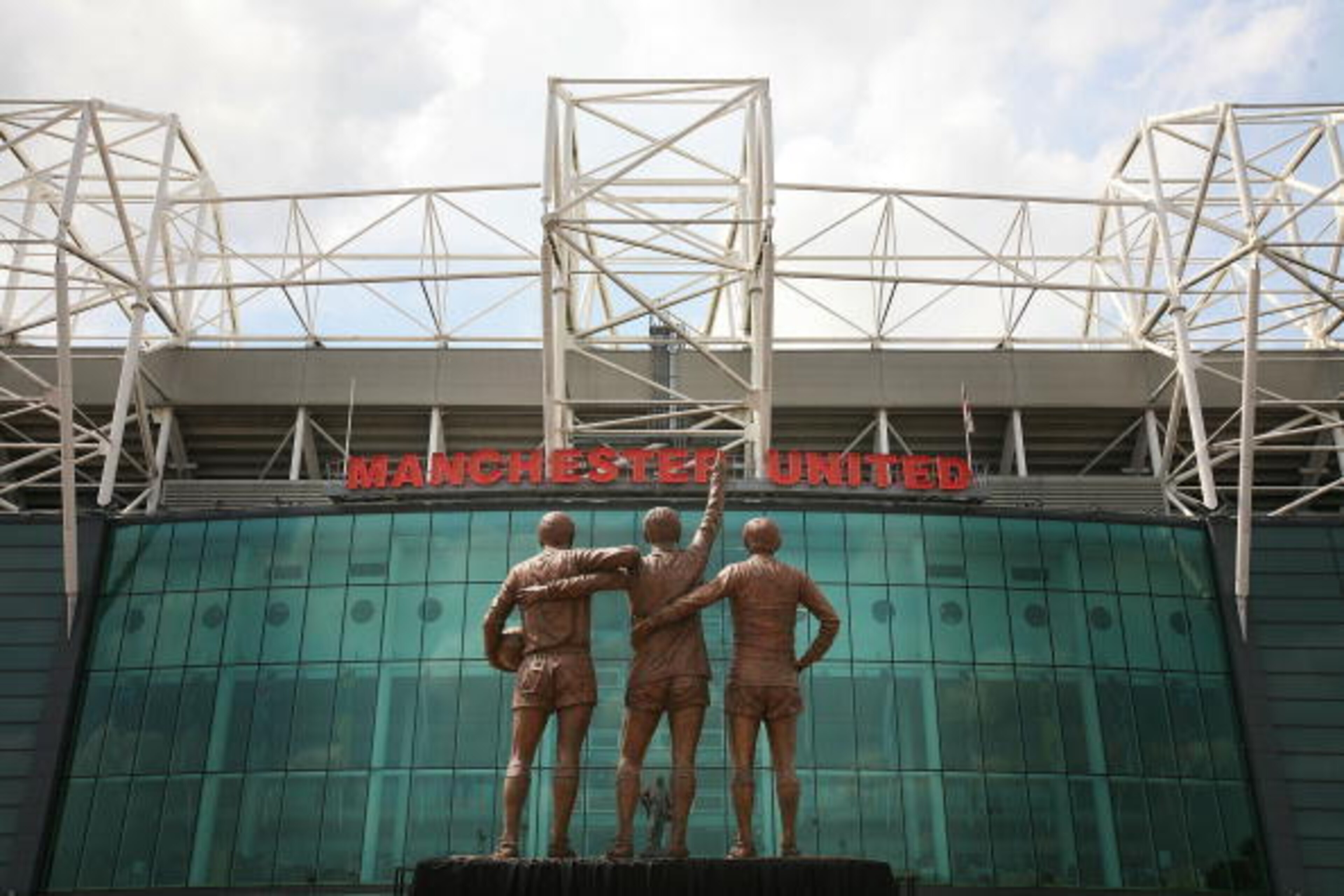 The Holy Trinity: Best, Law and Charlton commemorated in statue outside Old Trafford.