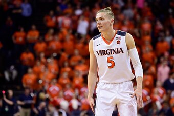 First things first: Kyle Guy's hairstyle is a top knot. It is not a man bun.