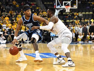 Rhode Island guard E.C. Matthews (left).
