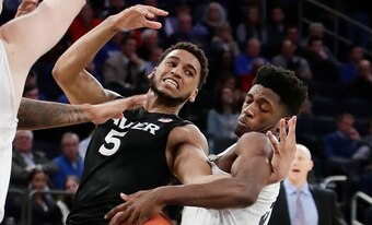 Trevon Bluiett (left).