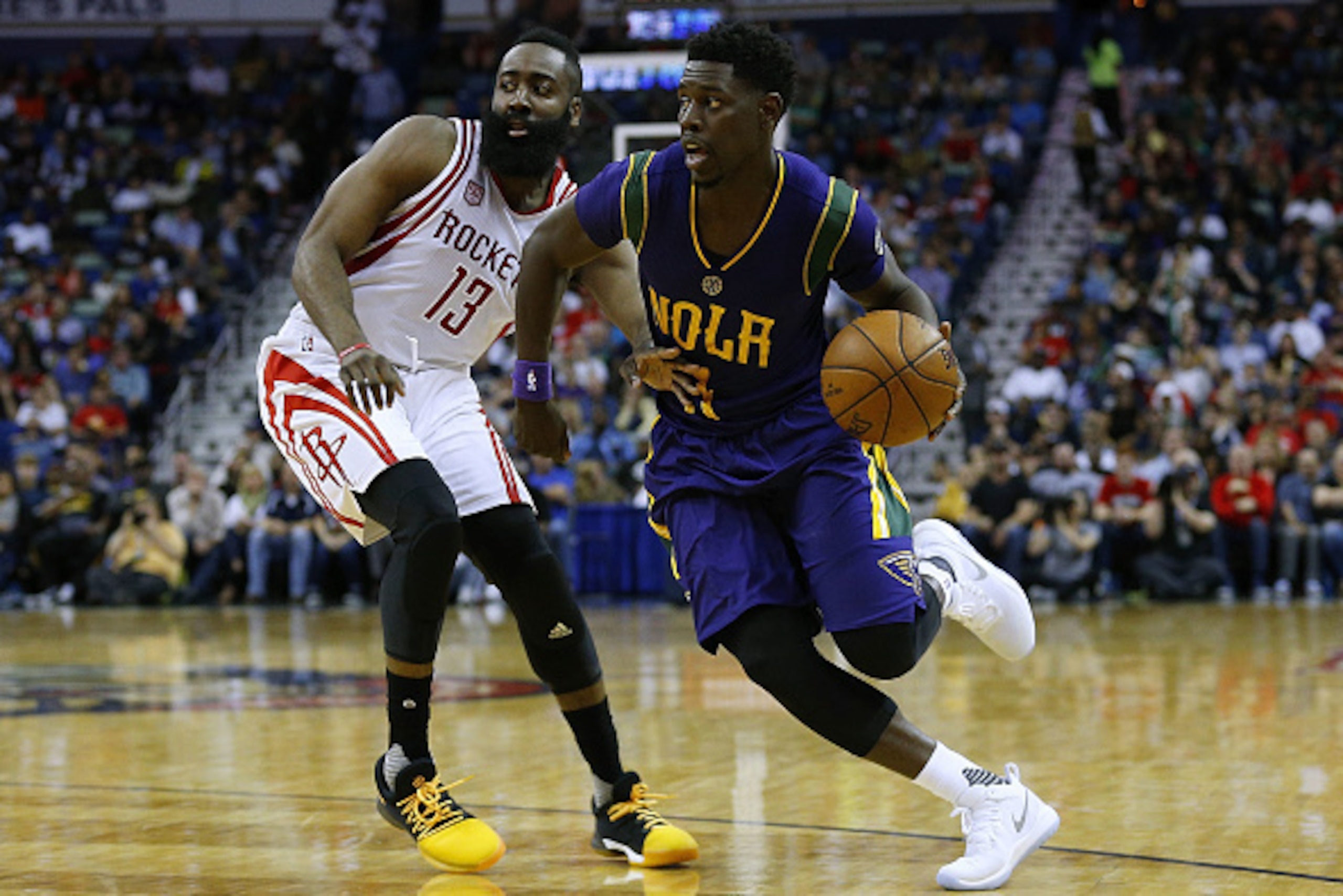 Jrue Holiday turns the corner on James Harden.