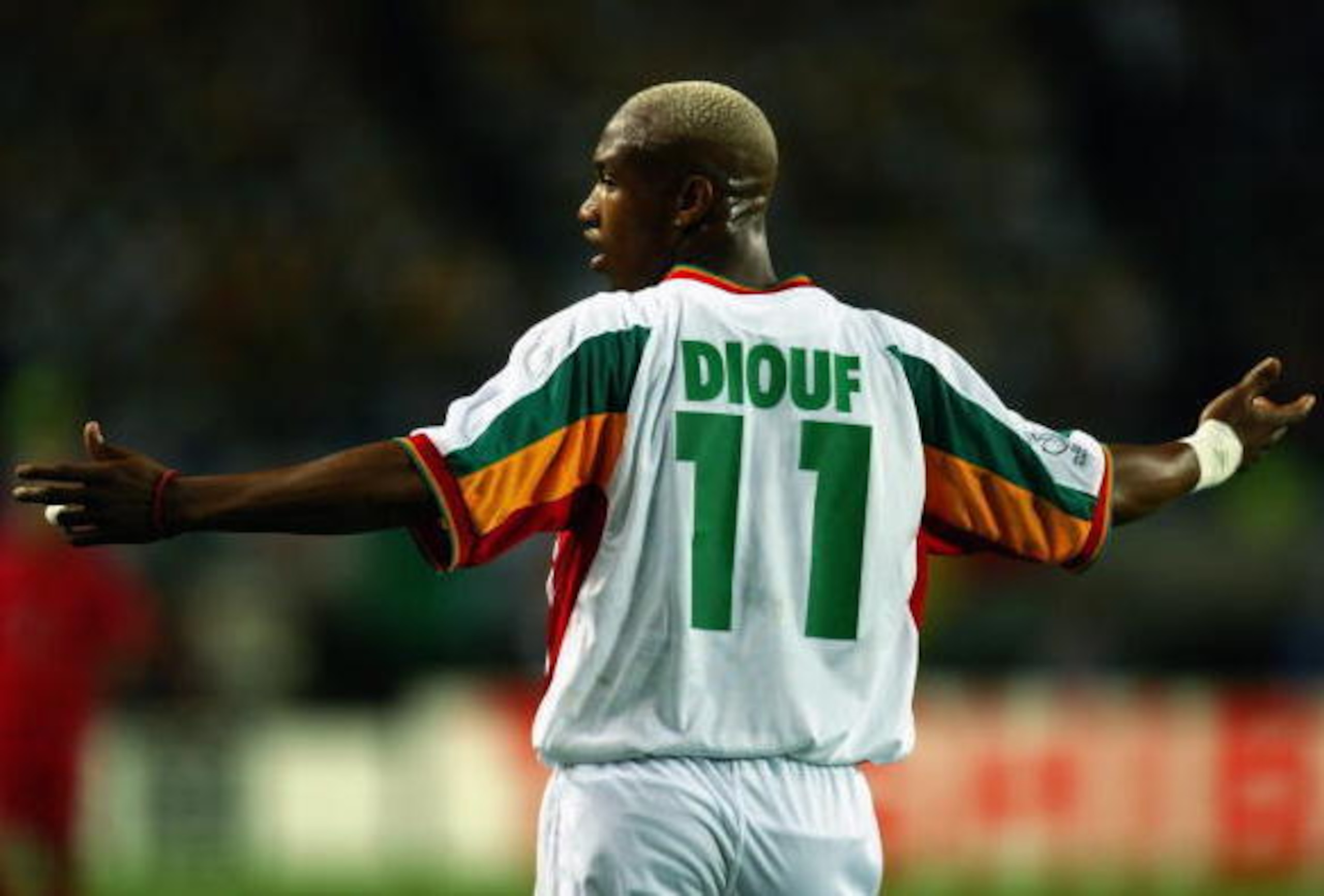 OSAKA - JUNE 22:  El Hadji Diouf of Senegal protests to the officials during the FIFA World Cup Finals 2002 Quarter Finals match between Senegal and Turkey played at the Osaka-Nagai Stadium, in Osaka, Japan on June 22, 2002. Turkey won the match 1-0 with 