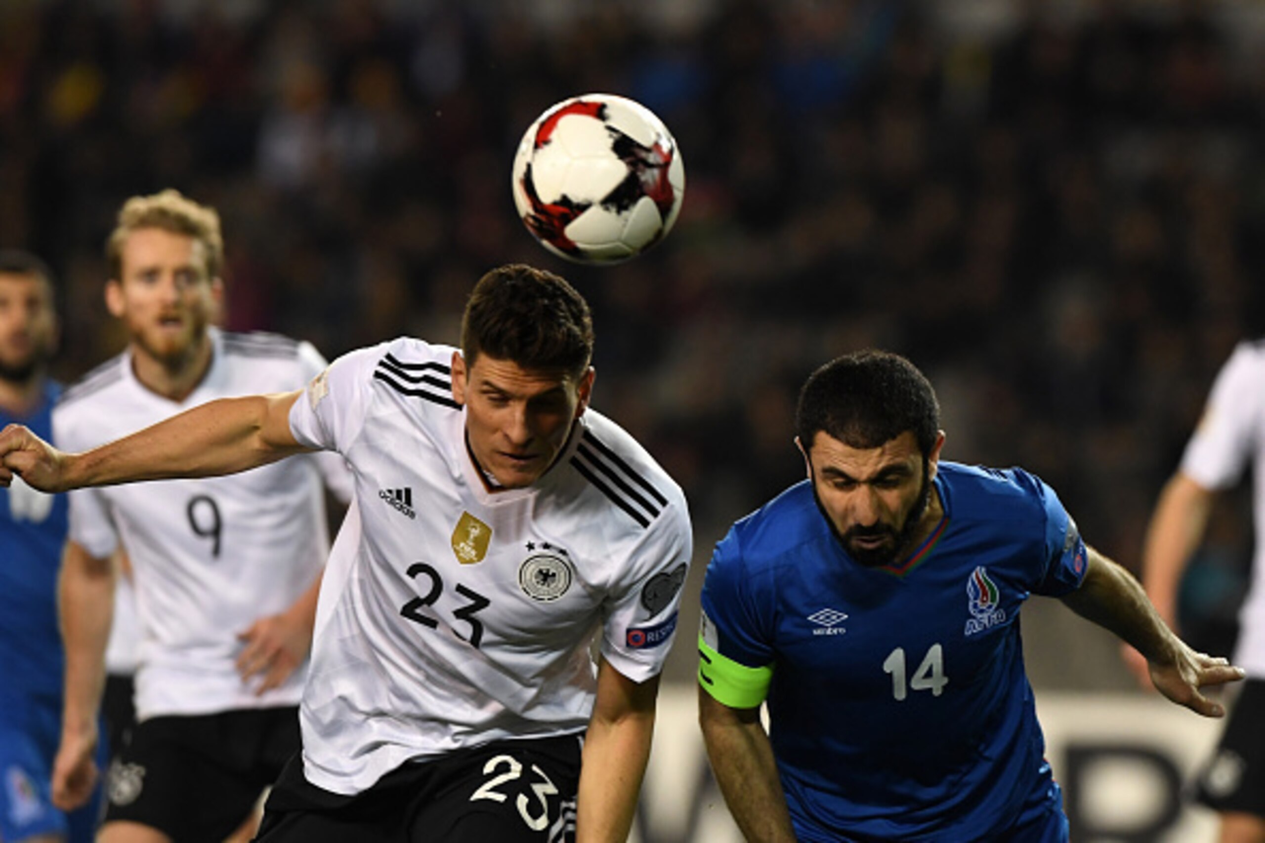 Germany's Mario Gomez (L) and Azerbaijan's Rashad F. Sadygov vie for the ball during the FIFA World Cup 2018 qualification football match between Azerbaijan and Germany in Baku on March 26, 2017. / AFP PHOTO / Kirill KUDRYAVTSEV        (Photo credit shoul
