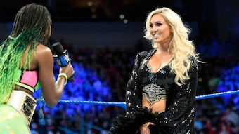 Naomi confronts Charlotte Flair on Tuesday's SmackDown.