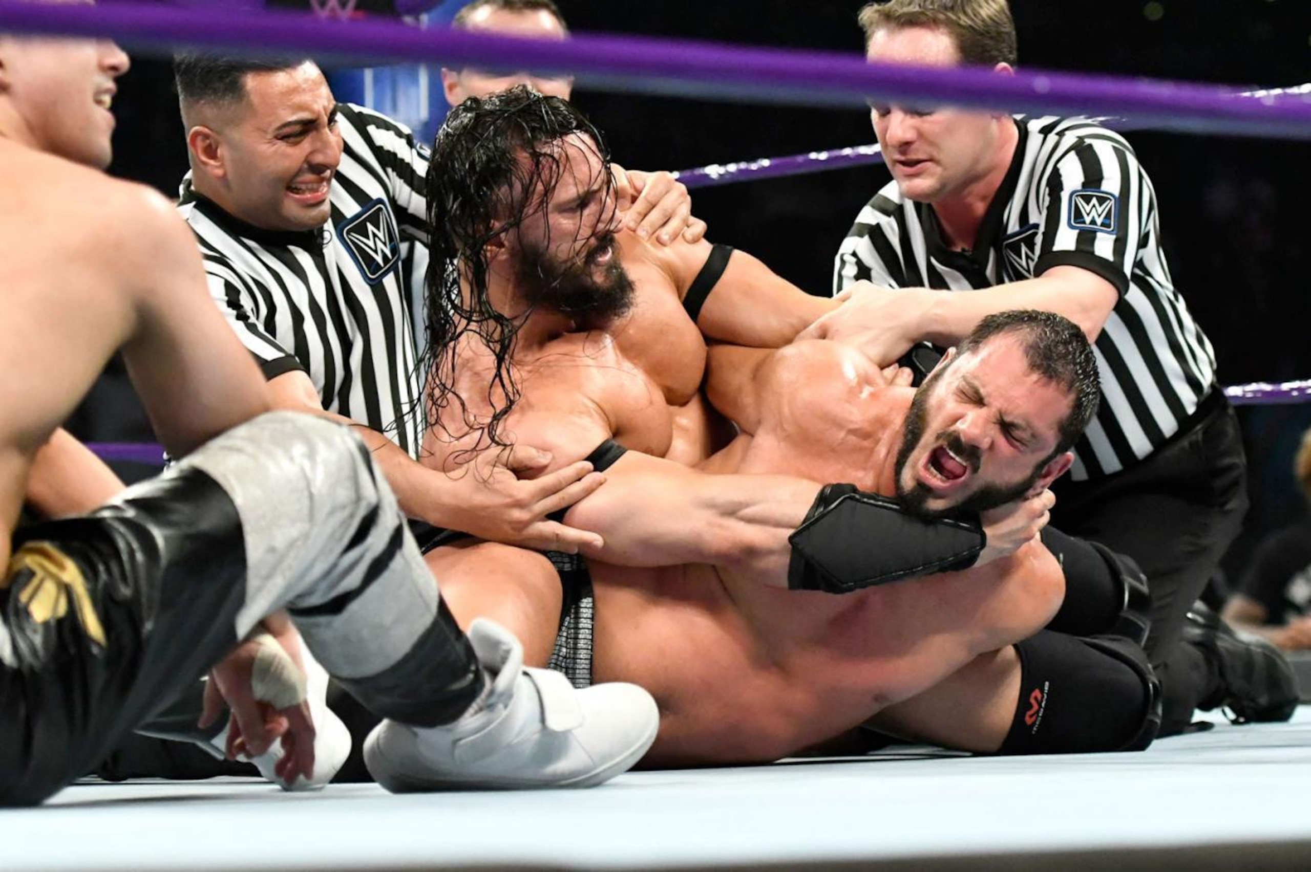 Neville punishes Austin Aries.