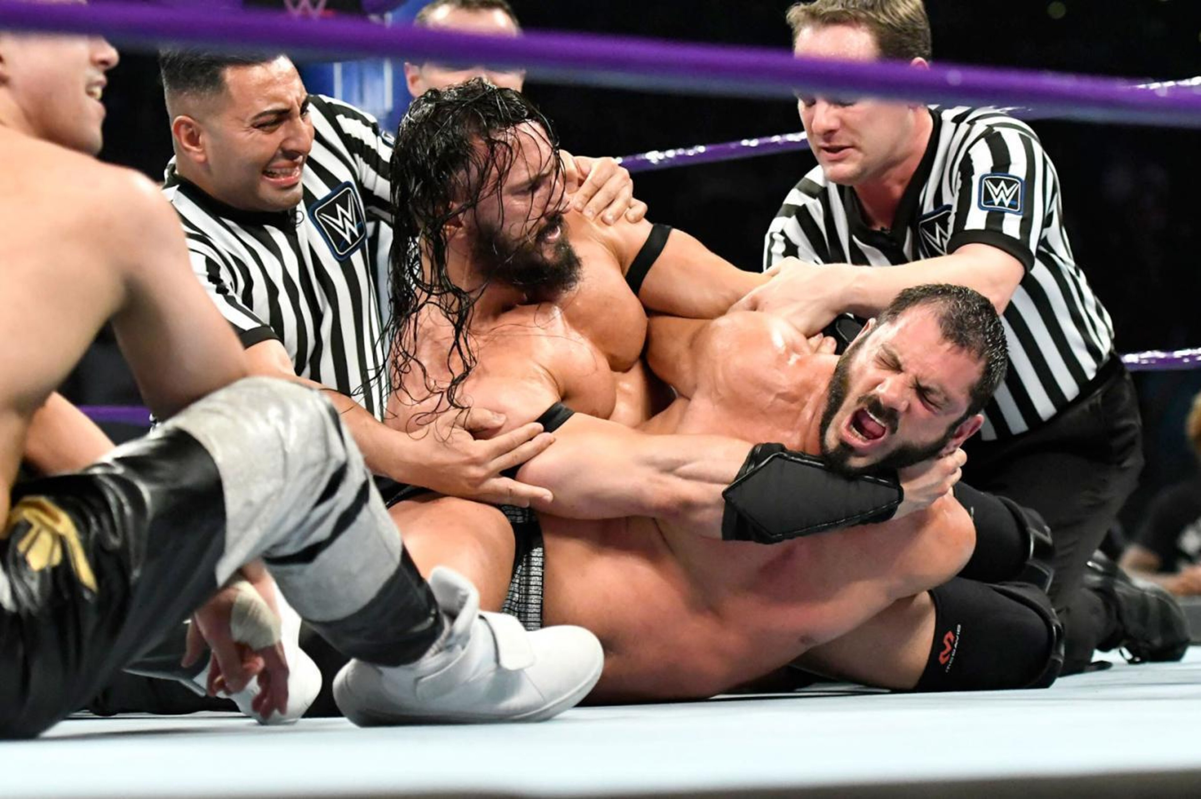 Neville punishes Austin Aries.