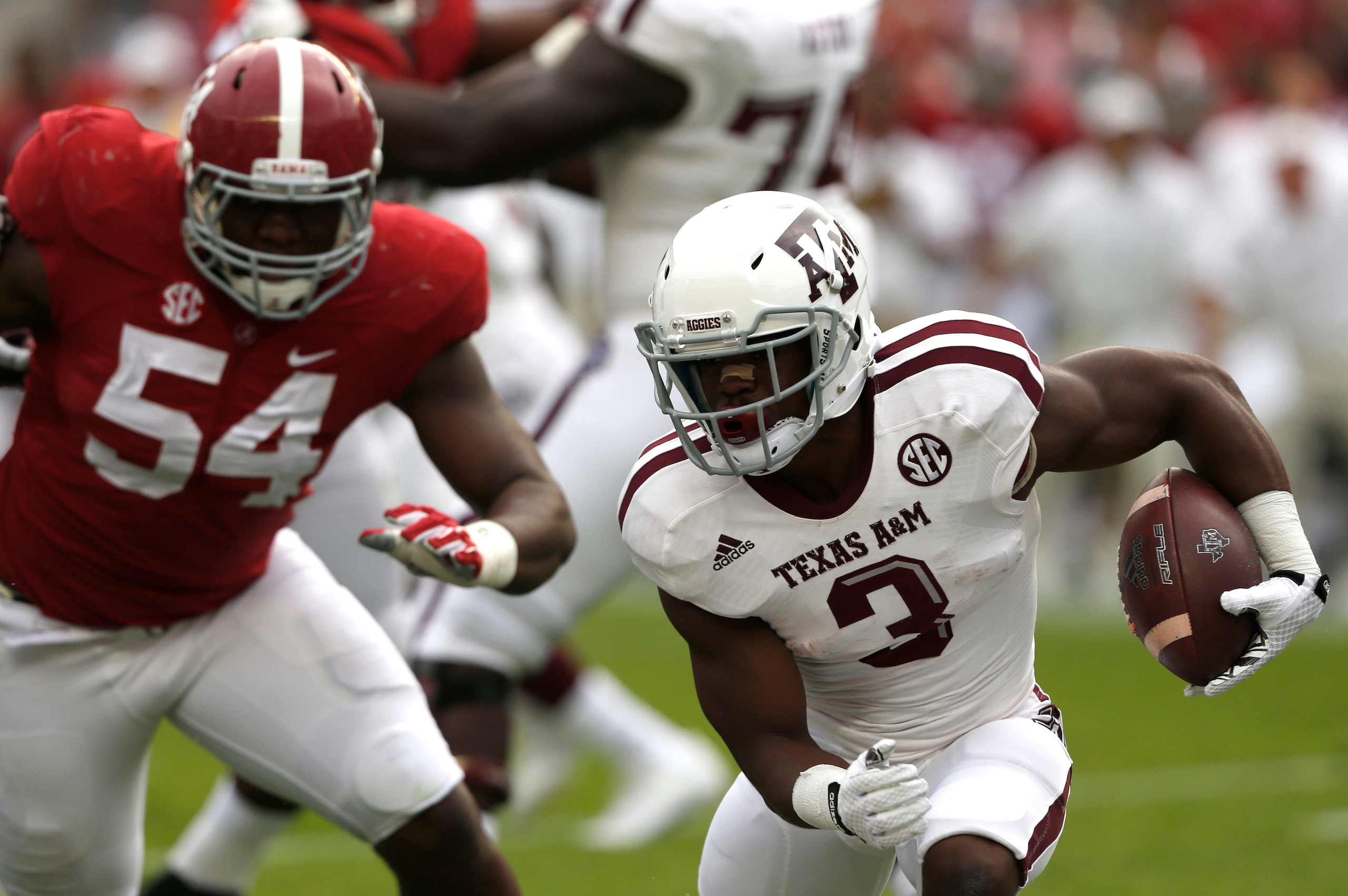 Alabama DT Dalvin Tomlinson (left)