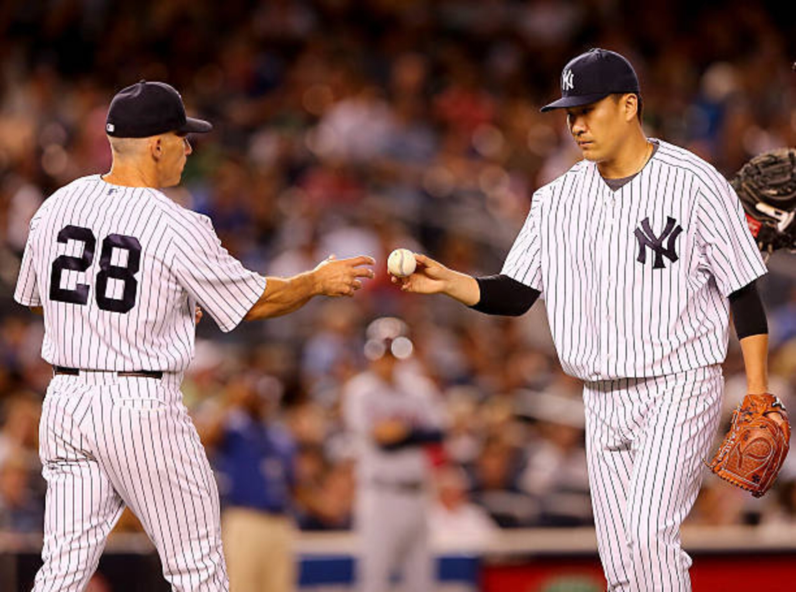 Manager Joe Girardi and right-hander Masahiro Tanaka. Manager Joe Girardi and right-hander Masahiro Tanaka.