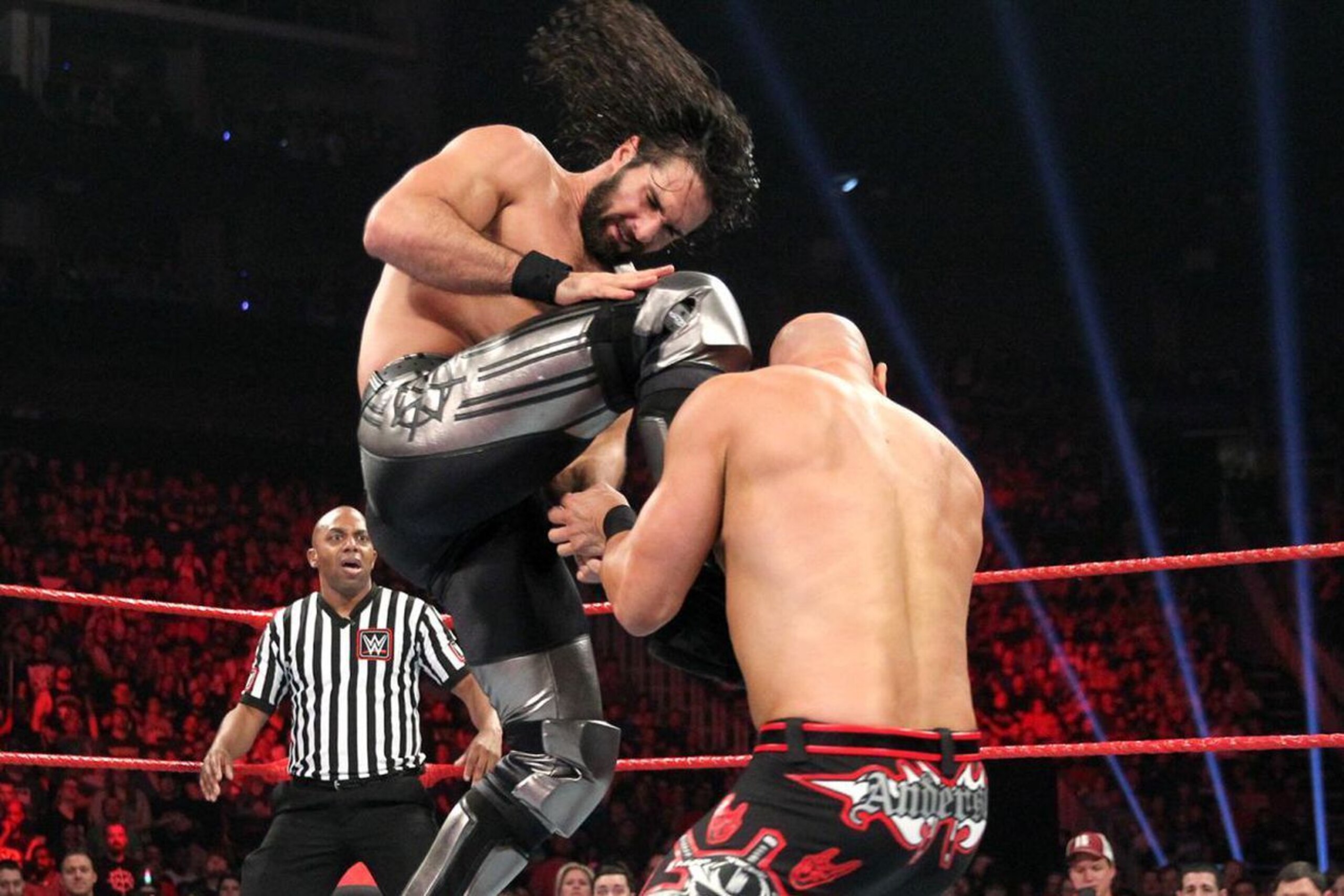 Seth Rollins hitting his new finishing move on Karl Anderson.
