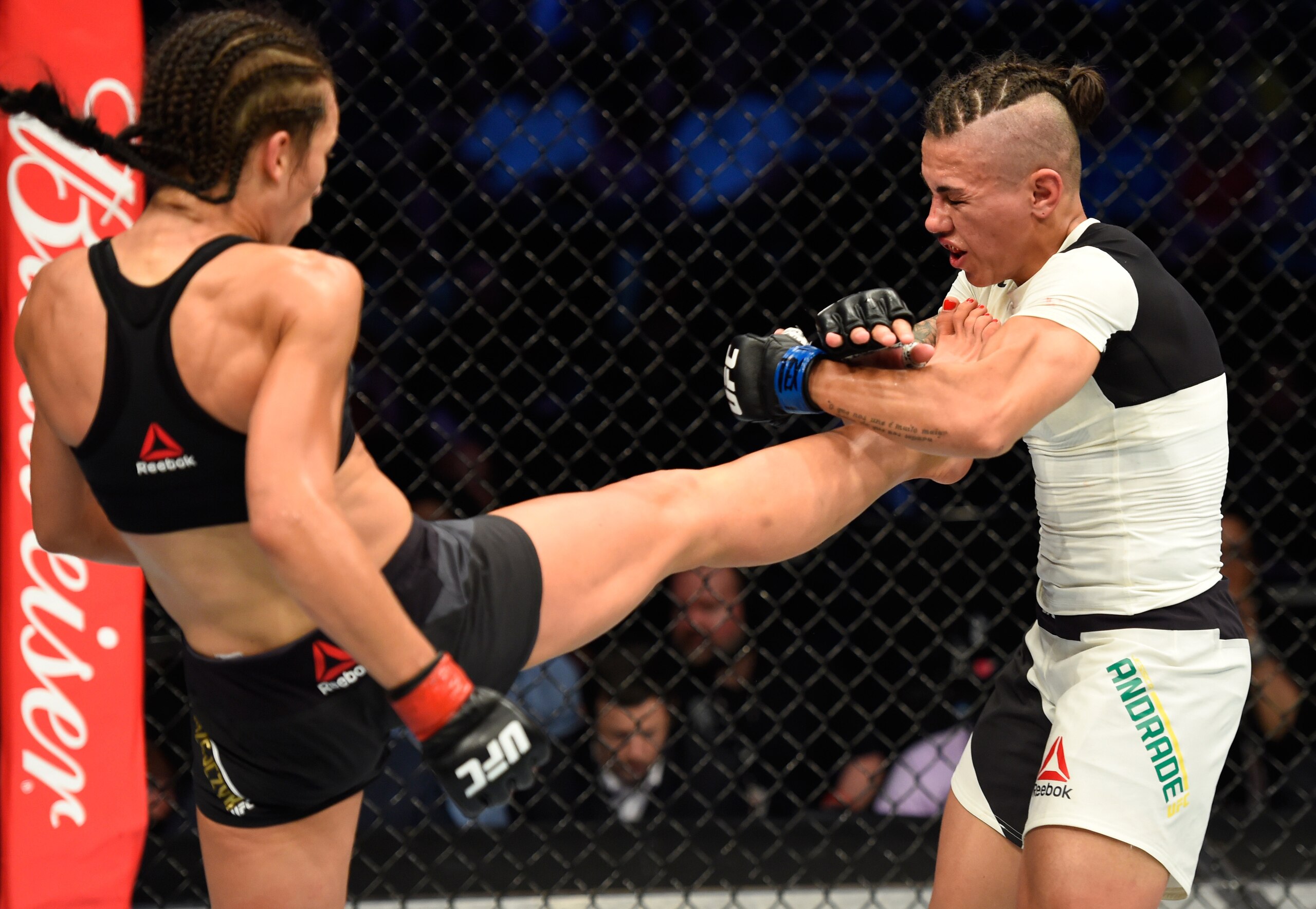 Joanna Jedrzejczyk (left) kicks Jessica Andrade