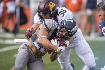 Blake Cashman wraps up an Illinois ball-carrier.