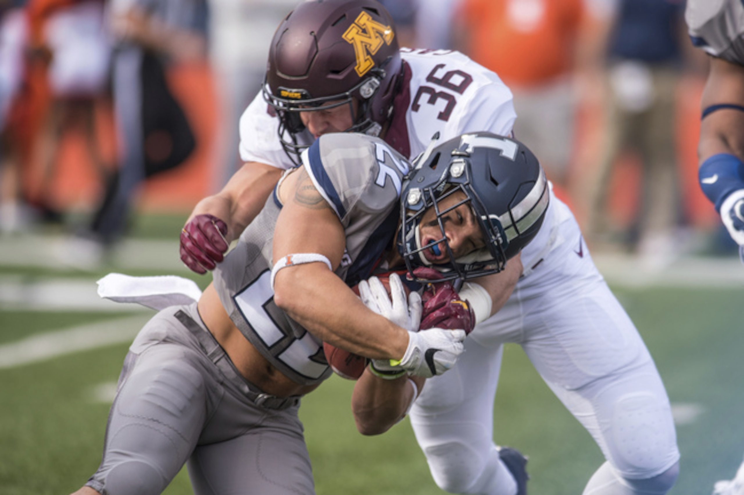 Blake Cashman wraps up an Illinois ball-carrier.