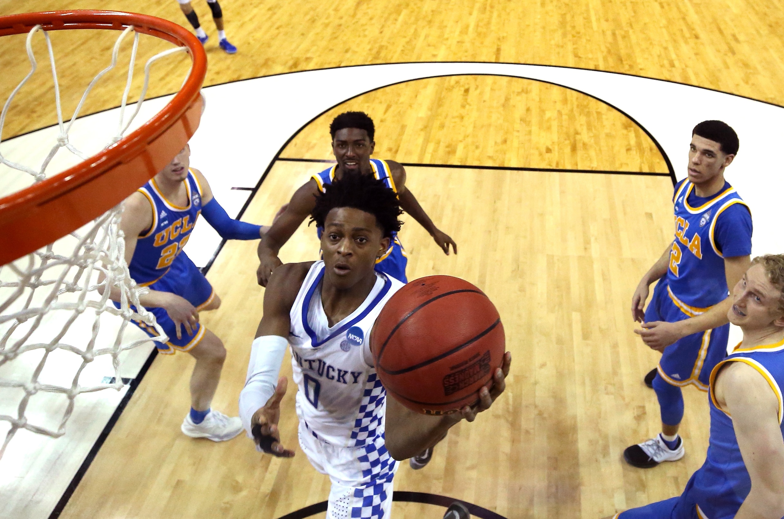 De'Aaron Fix sails by Lonzo Ball and the UCLA crew.