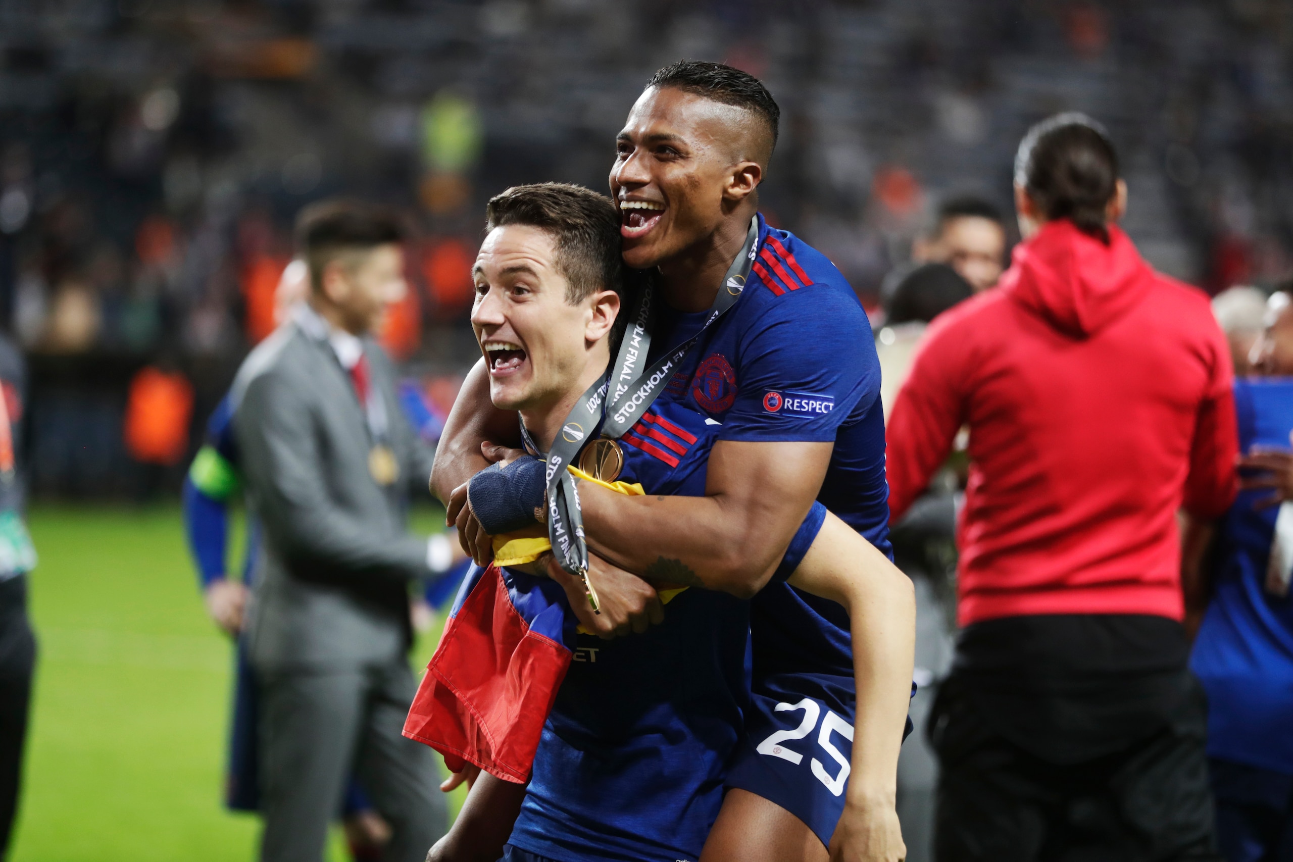 These men are both candidates, but the one getting the piggyback ride wins it.