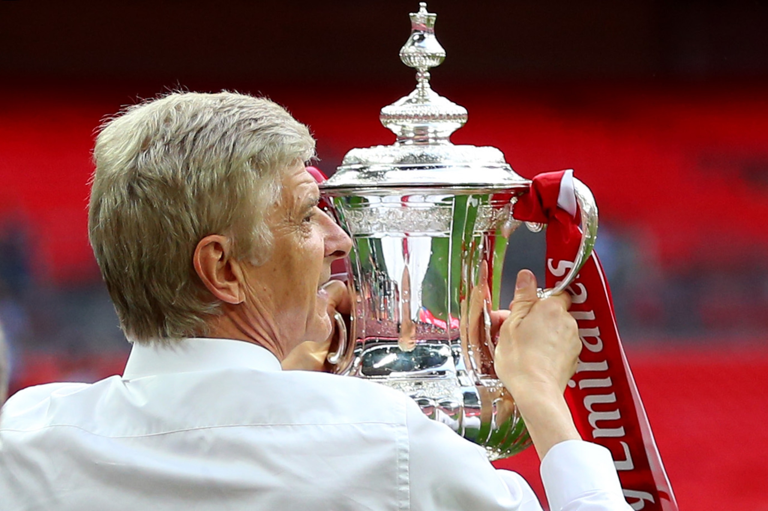 Arsene Wenger celebrates with the FA Cup.