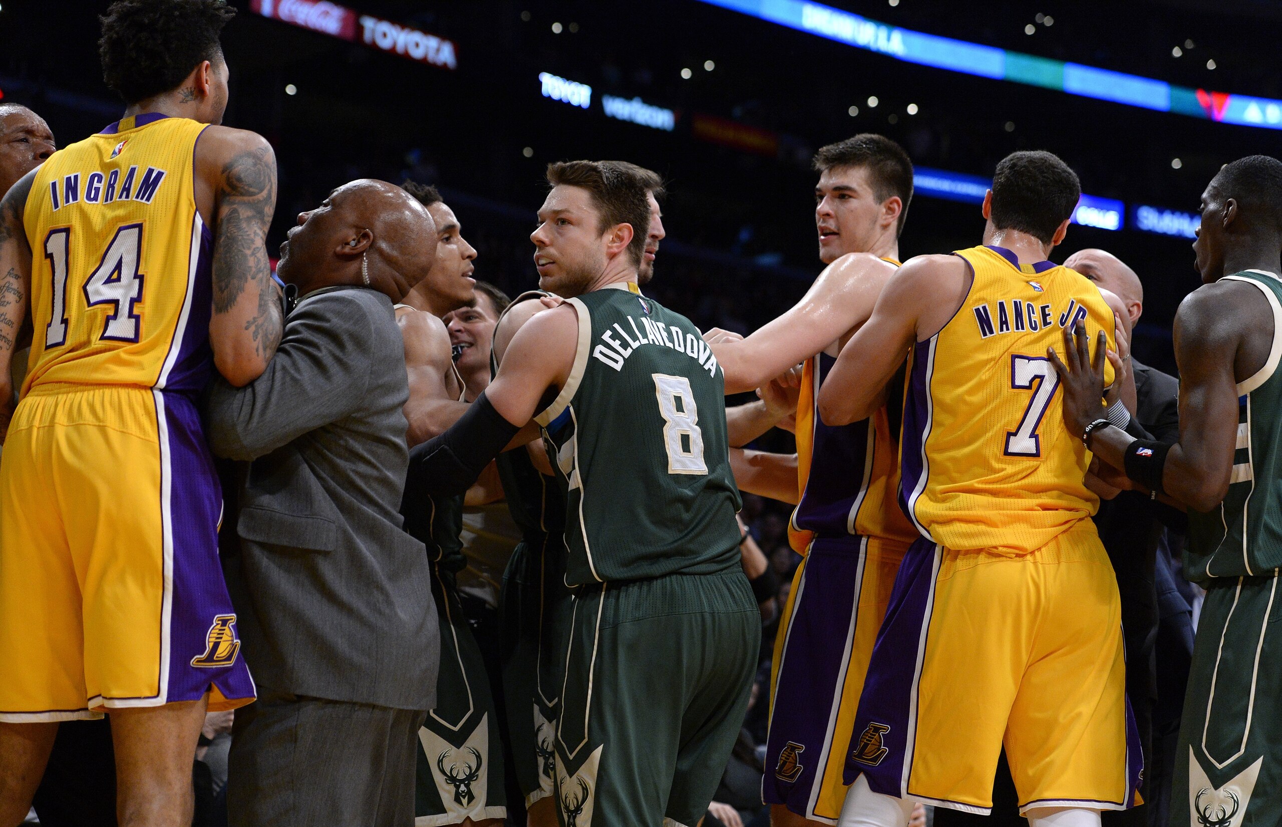 Larry Nance Jr. holds Zubac back during a squabble with the Milwaukee Bucks.