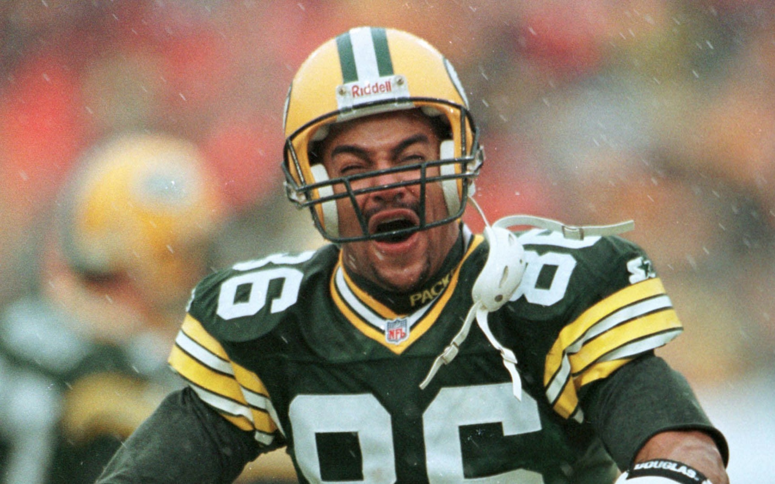 Green Bay Packers' Antonio Freeman reacts to a 4-yard touchdown catch by teammate Andre Rison in the first quarter of Green Bay's 35-14 win over the San Francisco 49ers on Saturday, Jan. 4, 1997, in Green Bay, Wis. (AP Photo/Morry Gash)