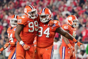 Clelin Ferrell (99) and Carlos Watkins (94)