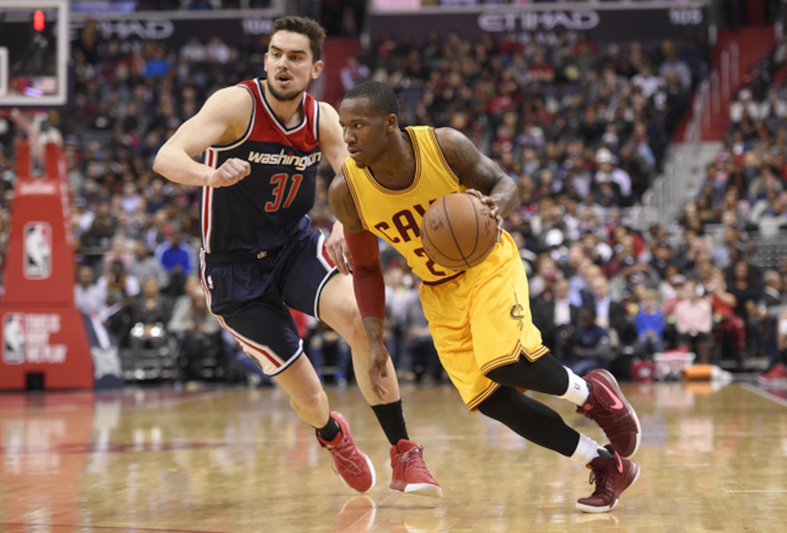 Cleveland's Kay Felder (R) drives past Washington's Tomas Satoransky. Cleveland's Kay Felder (R) drives past Washington's Tomas Satoransky.