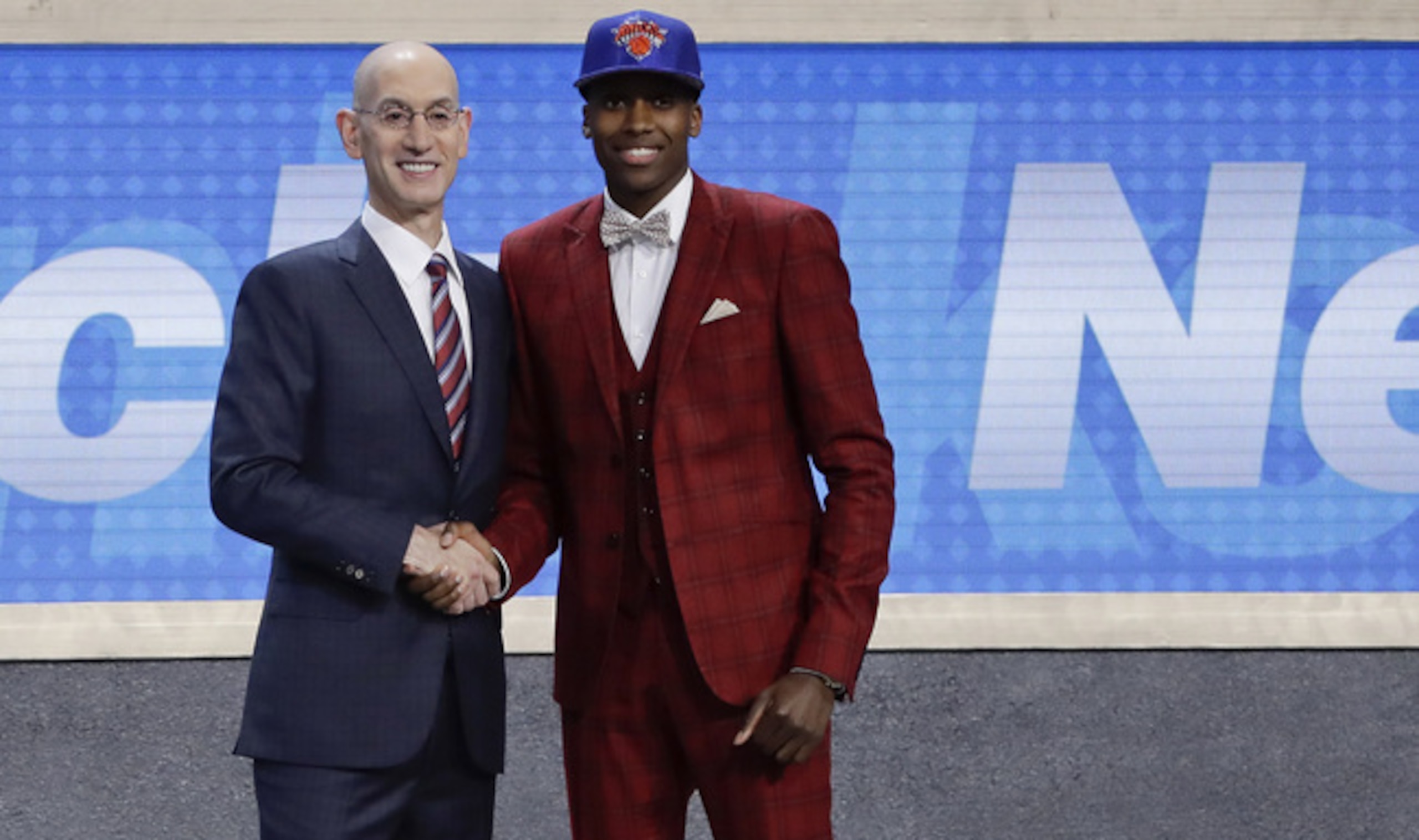 New York's Frank Ntilikina (R) shakes hands with commissioner Adam Silver at the 2017 draft. New York's Frank Ntilikina (R) shakes hands with commissioner Adam Silver at the 2017 draft.