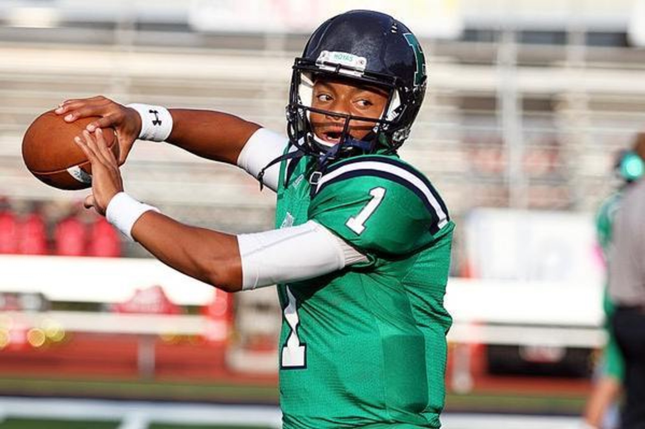 Harrison (Ga.) quarterback Justin Fields is one of the top uncommitted prospects performing at The Opening.