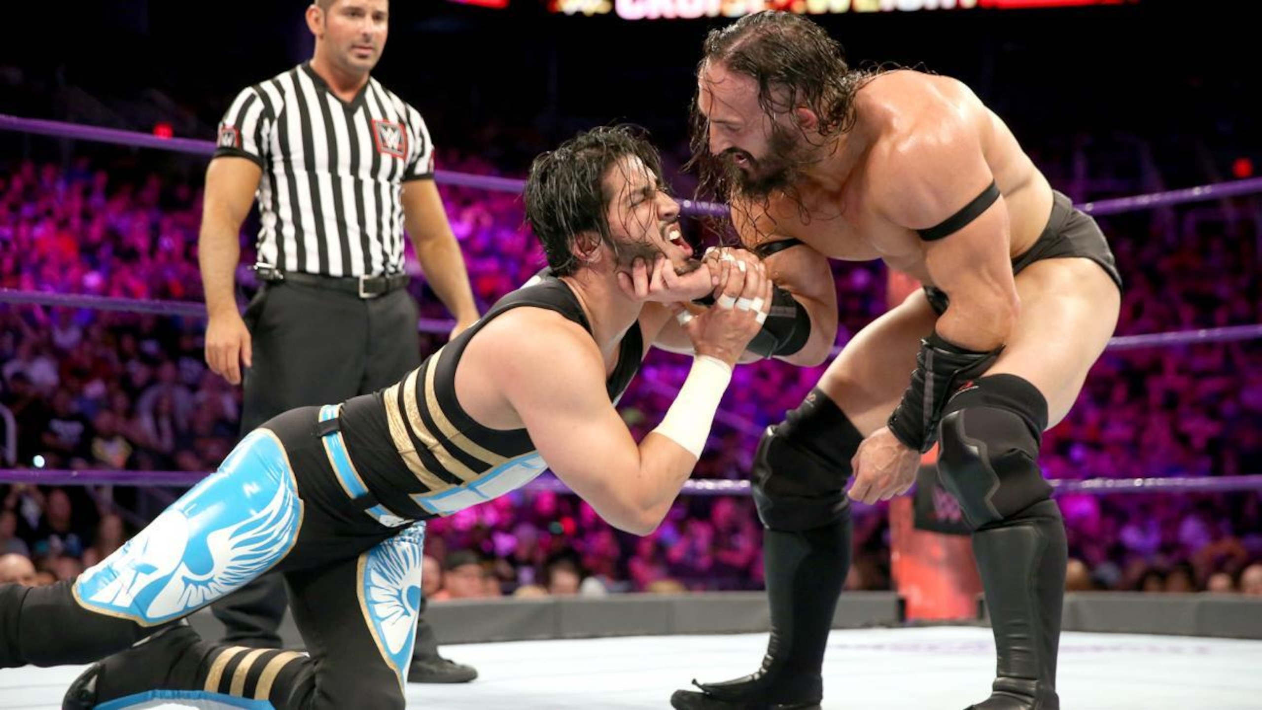 Neville toys with Mustafa Ali.