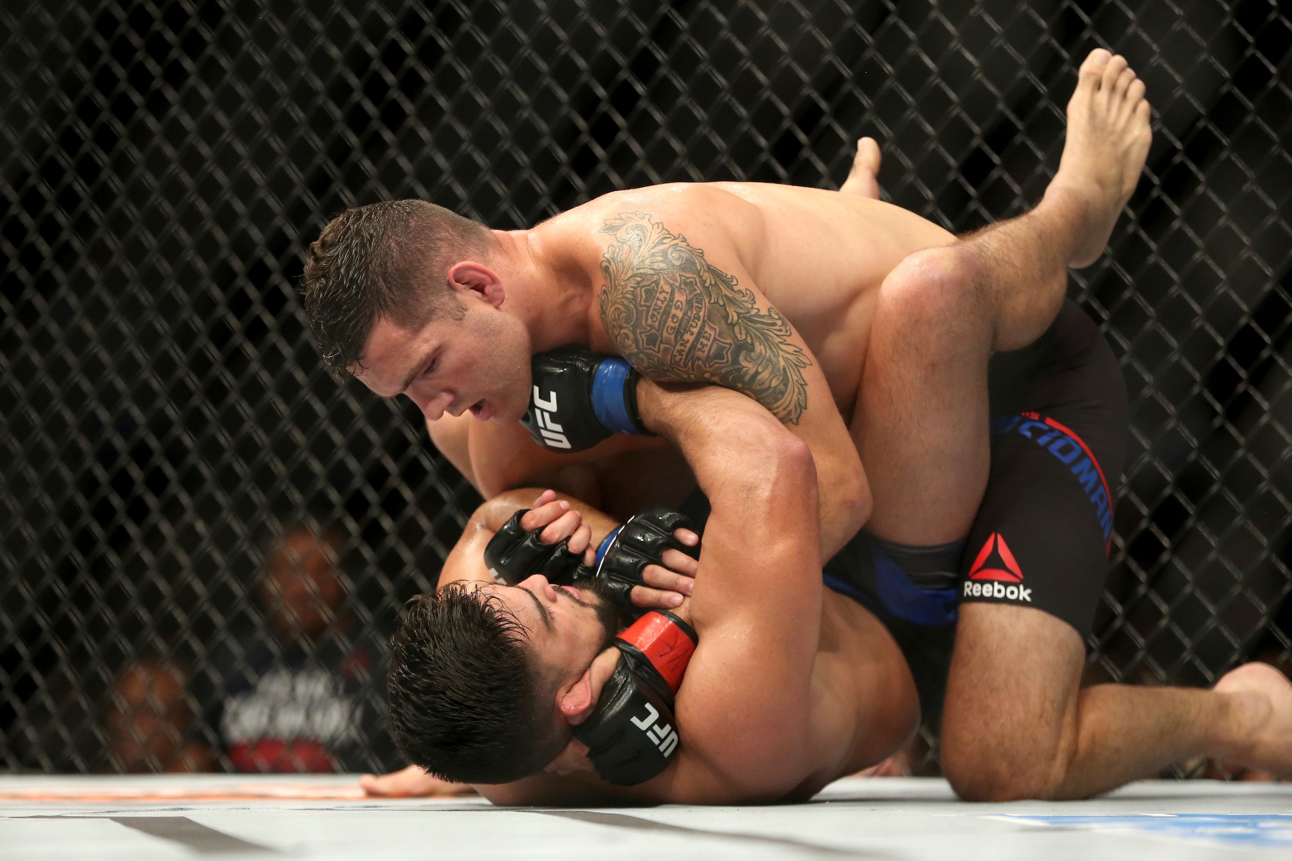 Chris Weidman (top) controls Kelvin Gastelum Chris Weidman (top) controls Kelvin Gastelum