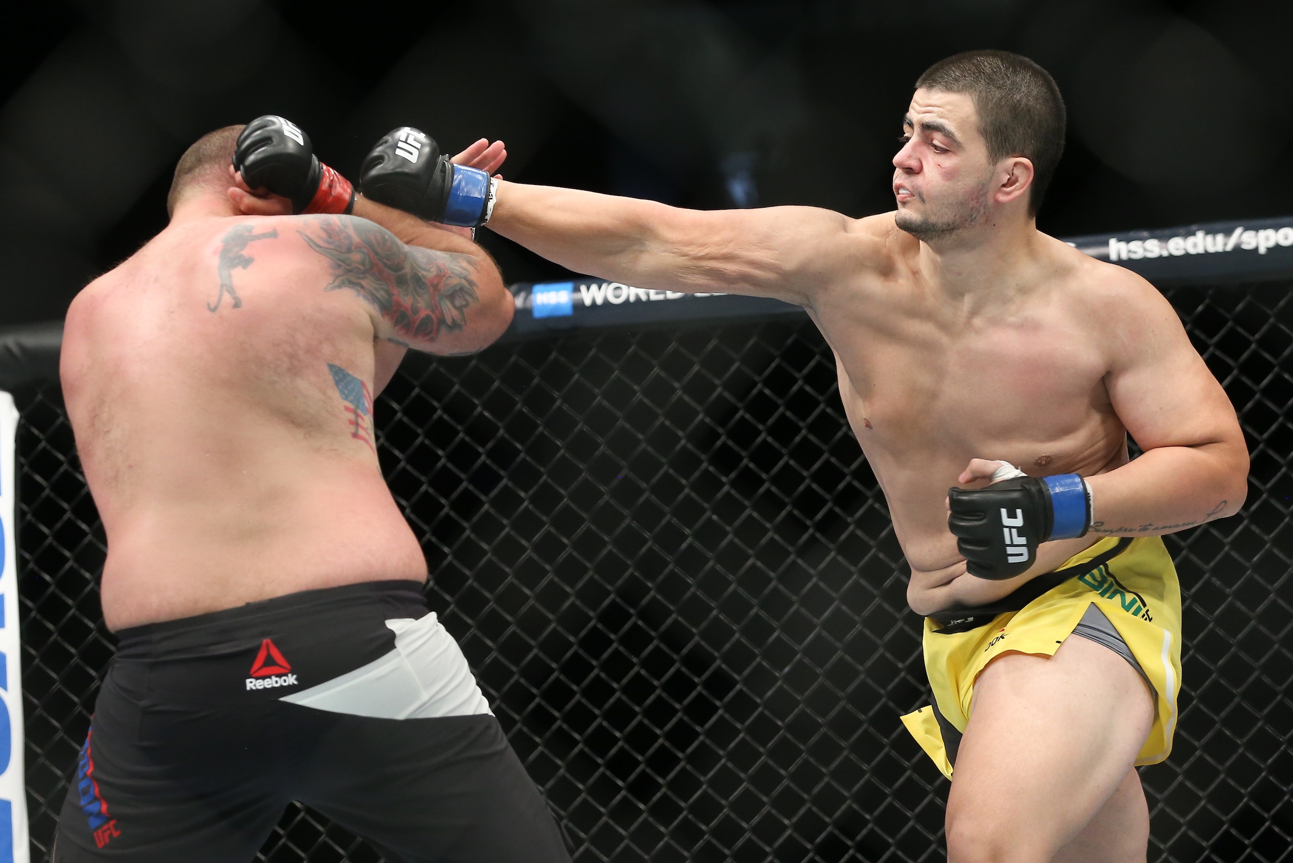 Junior Albini (right) hits Tim Johnson Junior Albini (right) hits Tim Johnson