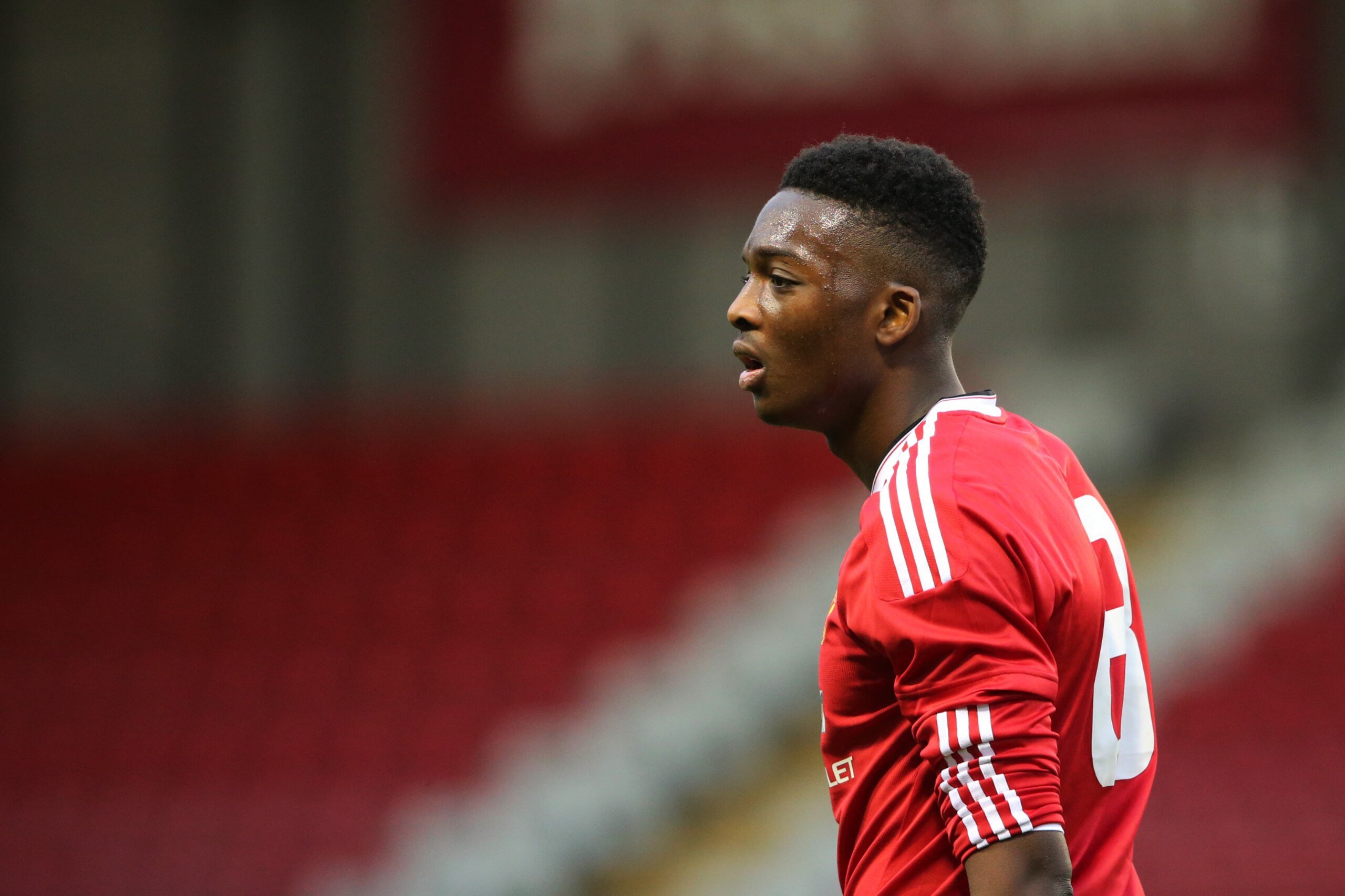Matty Willock in youth-team action for United.