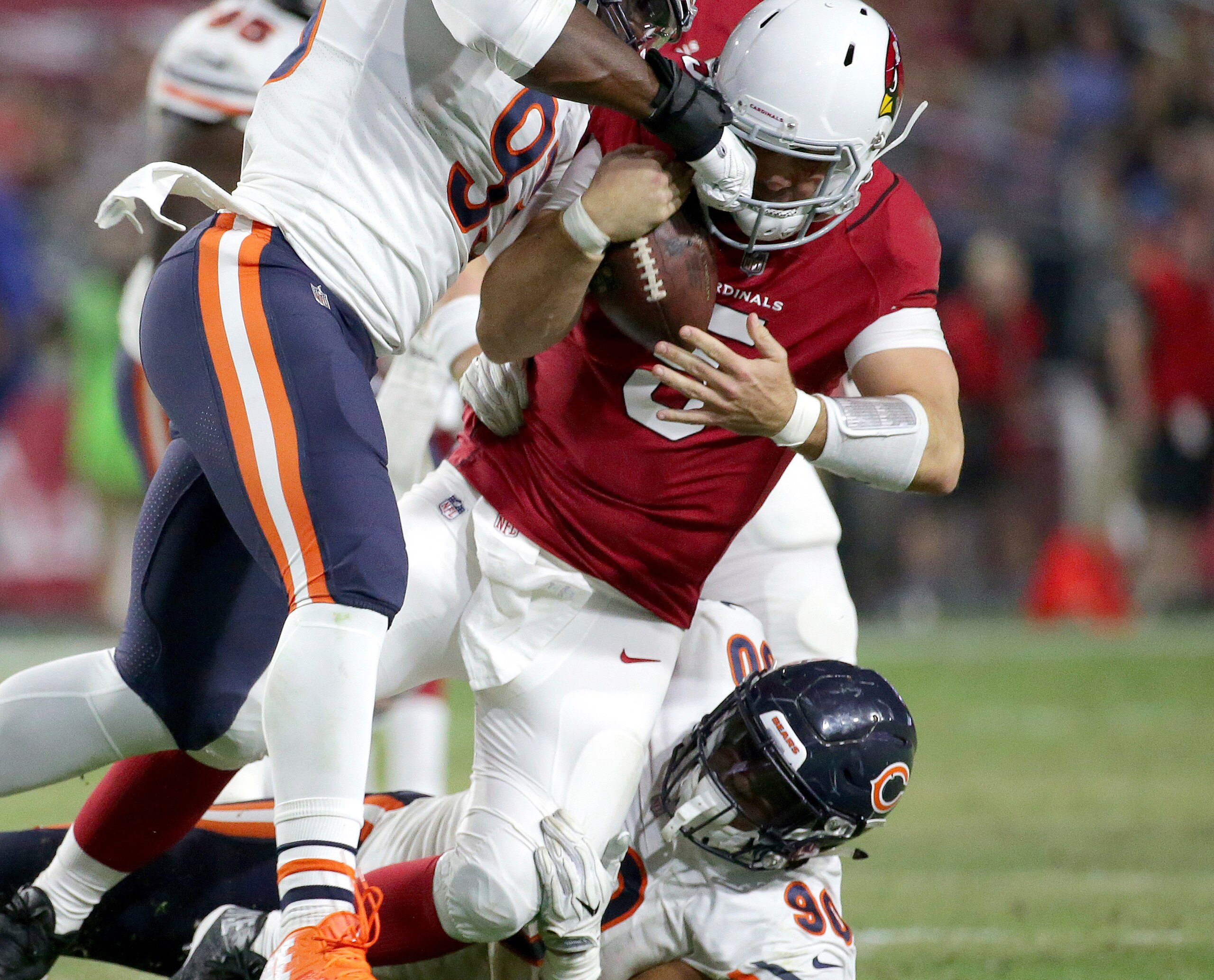 Arizona Cardinals quarterback Drew Stanton (5) is sacked by Chicago Bears defensive end Jonathan Bullard, right, during the first half of a preseason NFL football game, Saturday, Aug. 19, 2017, in Glendale, Ariz. (AP Photo/Ralph Freso)