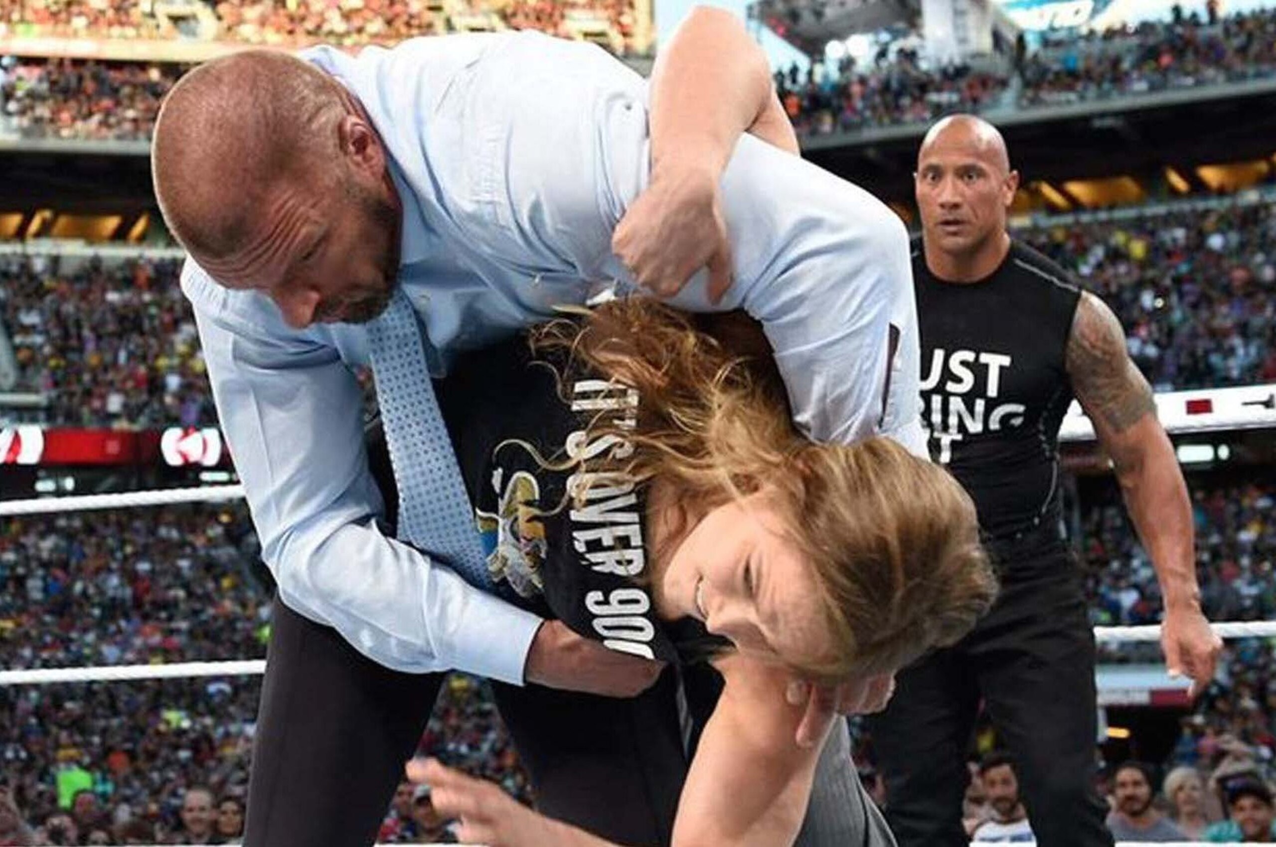 Ronda Rousey taking down Triple H at WrestleMania 31.
