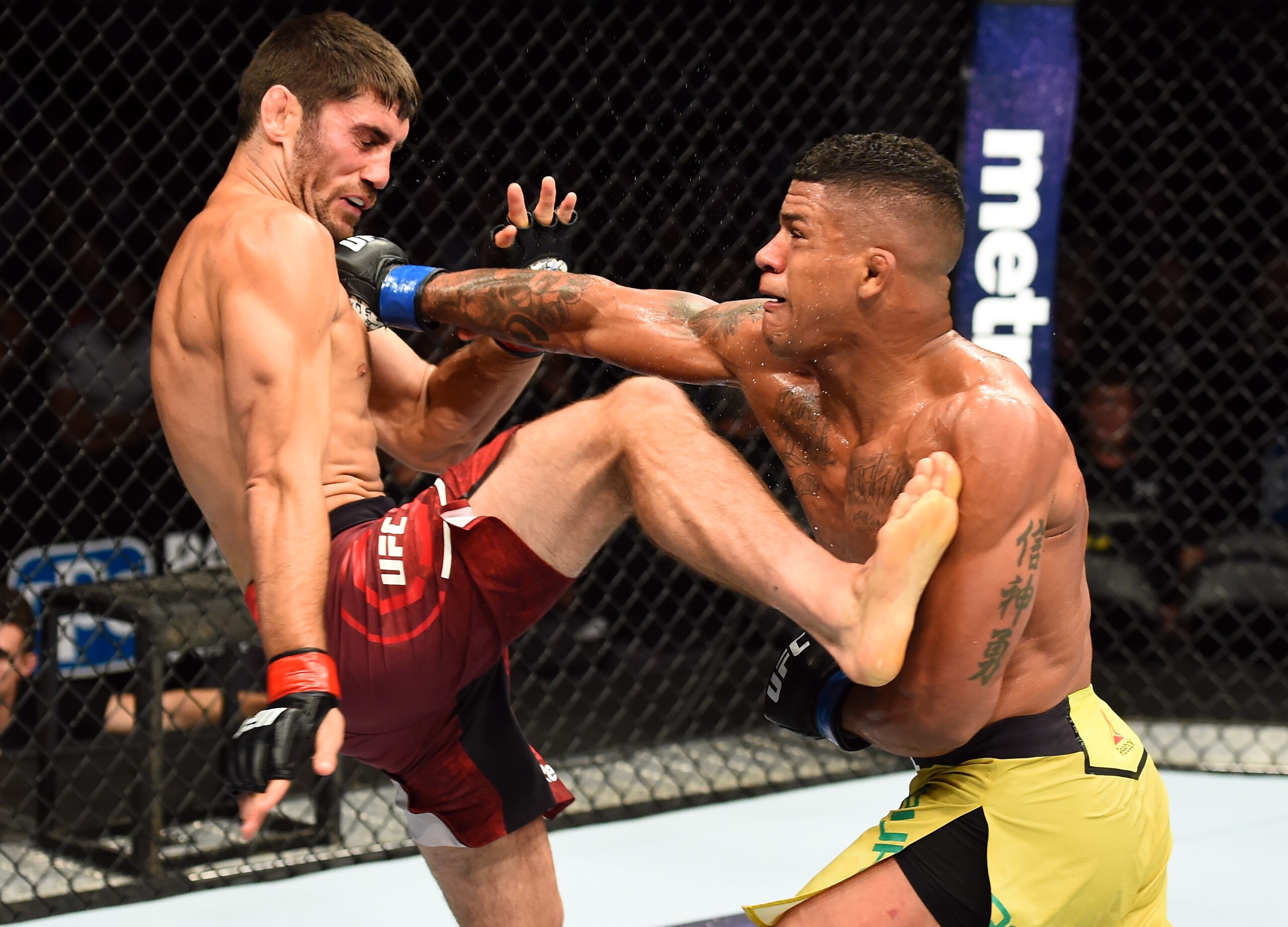 Gilbert Burns (right) knocked out Jason Saggo in the first bout of the evening.