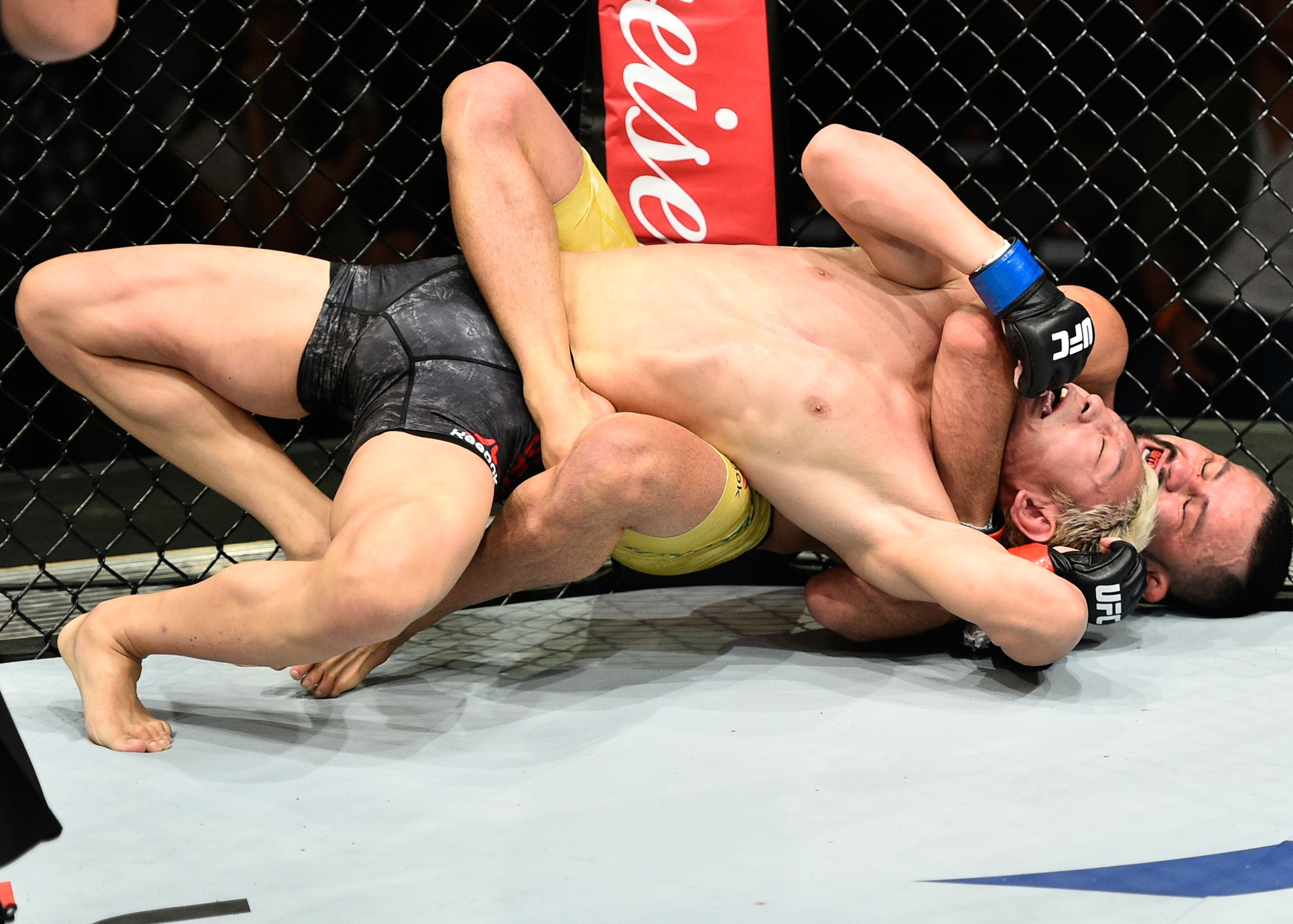 Ulka Sasaki attempts to defend a choke from Jussier Formiga. Ulka Sasaki attempts to defend a choke from Jussier Formiga.