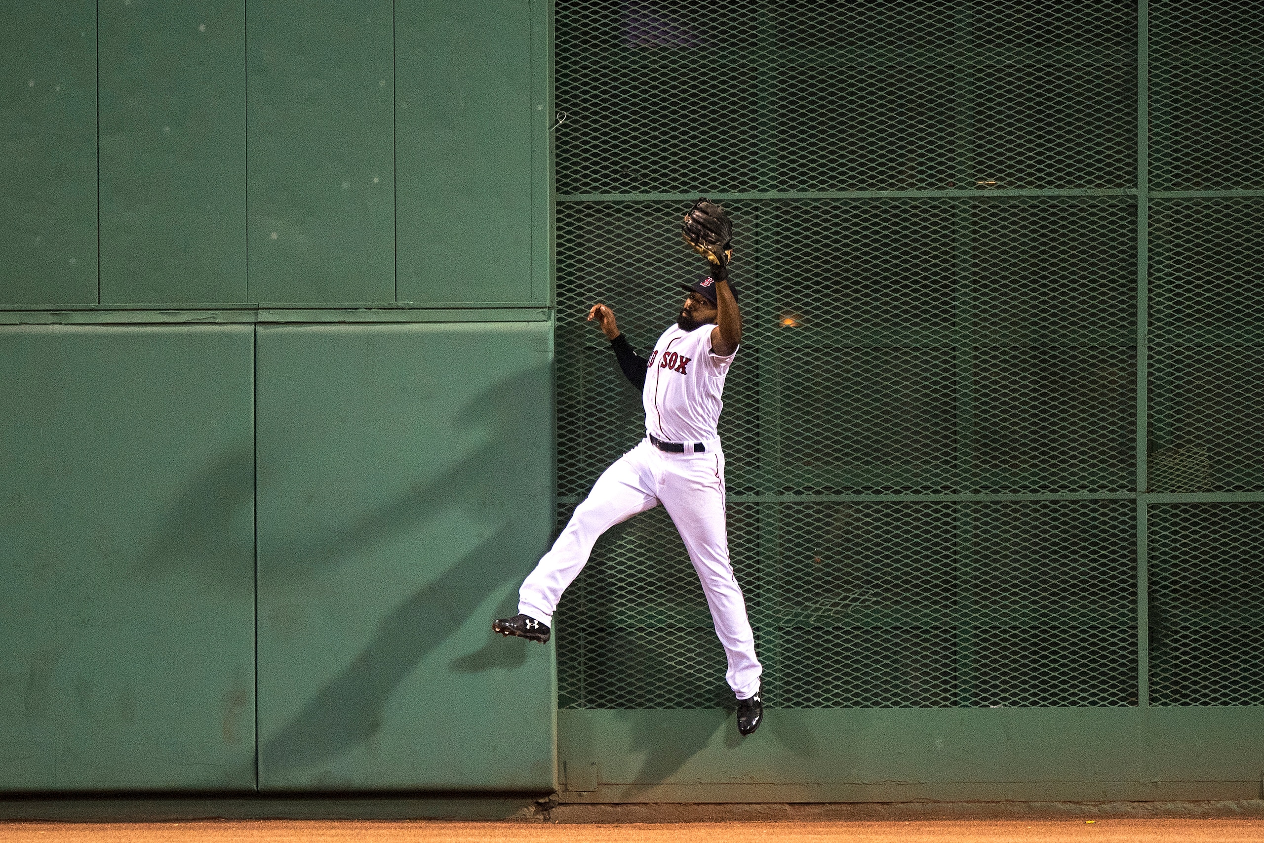 BOSTON, MA - AUGUST 19: Jackie Bradley Jr. #19 of the Boston Red Sox makes a leaping catch to deny Tyler Austin #26 of the New York Yankees a hit during the fourth inning of a game on August 19, 2017 at Fenway Park in Boston, Massachusetts. (Photo by Bill