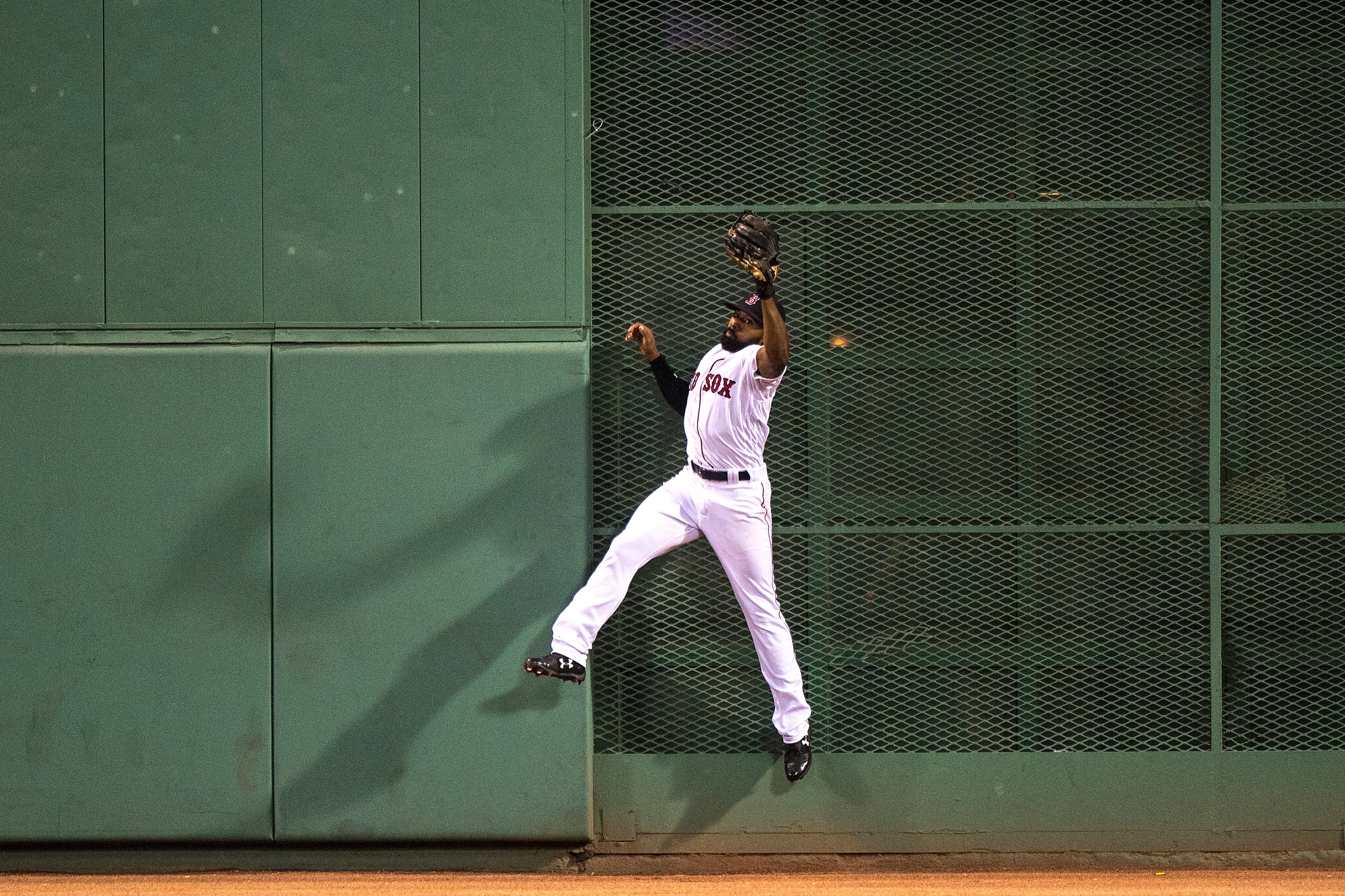 BOSTON, MA - AUGUST 19: Jackie Bradley Jr. #19 of the Boston Red Sox makes a leaping catch to deny Tyler Austin #26 of the New York Yankees a hit during the fourth inning of a game on August 19, 2017 at Fenway Park in Boston, Massachusetts. (Photo by Bill