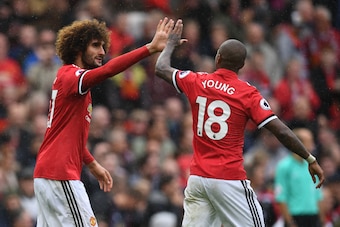 Young and Fellaini celebrate another successful link-up.