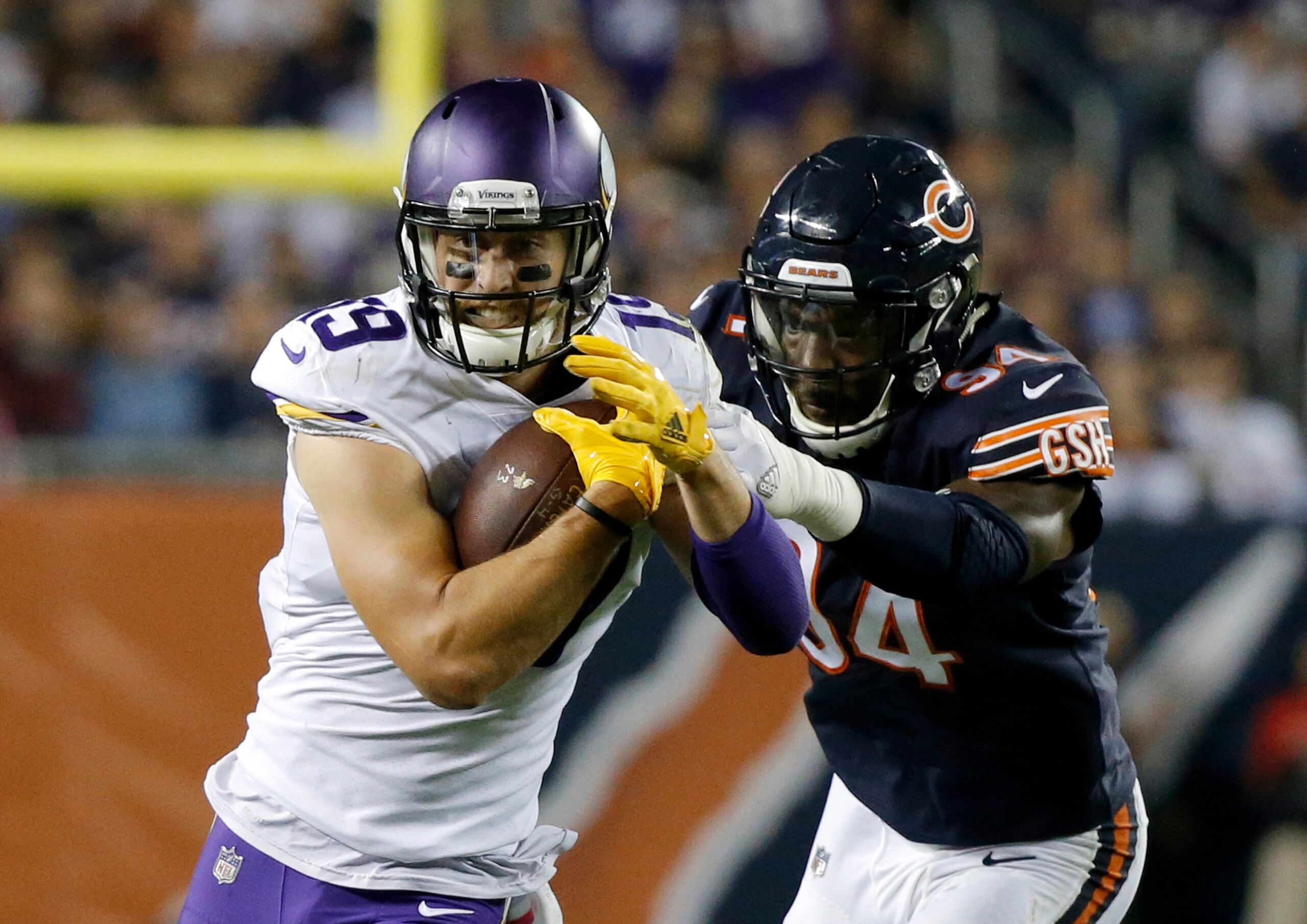 CHICAGO, IL - OCTOBER 09: Adam Thielen #19 of the Minnesota Vikings carries the football against Leonard Floyd #94 of the Chicago Bears in the third quarter at Soldier Field on October 9, 2017 in Chicago, Illinois. (Photo by Jon Durr/Getty Images) CHICAGO, IL - OCTOBER 09: Adam Thielen #19 of the Minnesota Vikings carries the football against Leonard Floyd #94 of the Chicago Bears in the third quarter at Soldier Field on October 9, 2017 in Chicago, Illinois. (Photo by Jon Durr/Getty Images)
