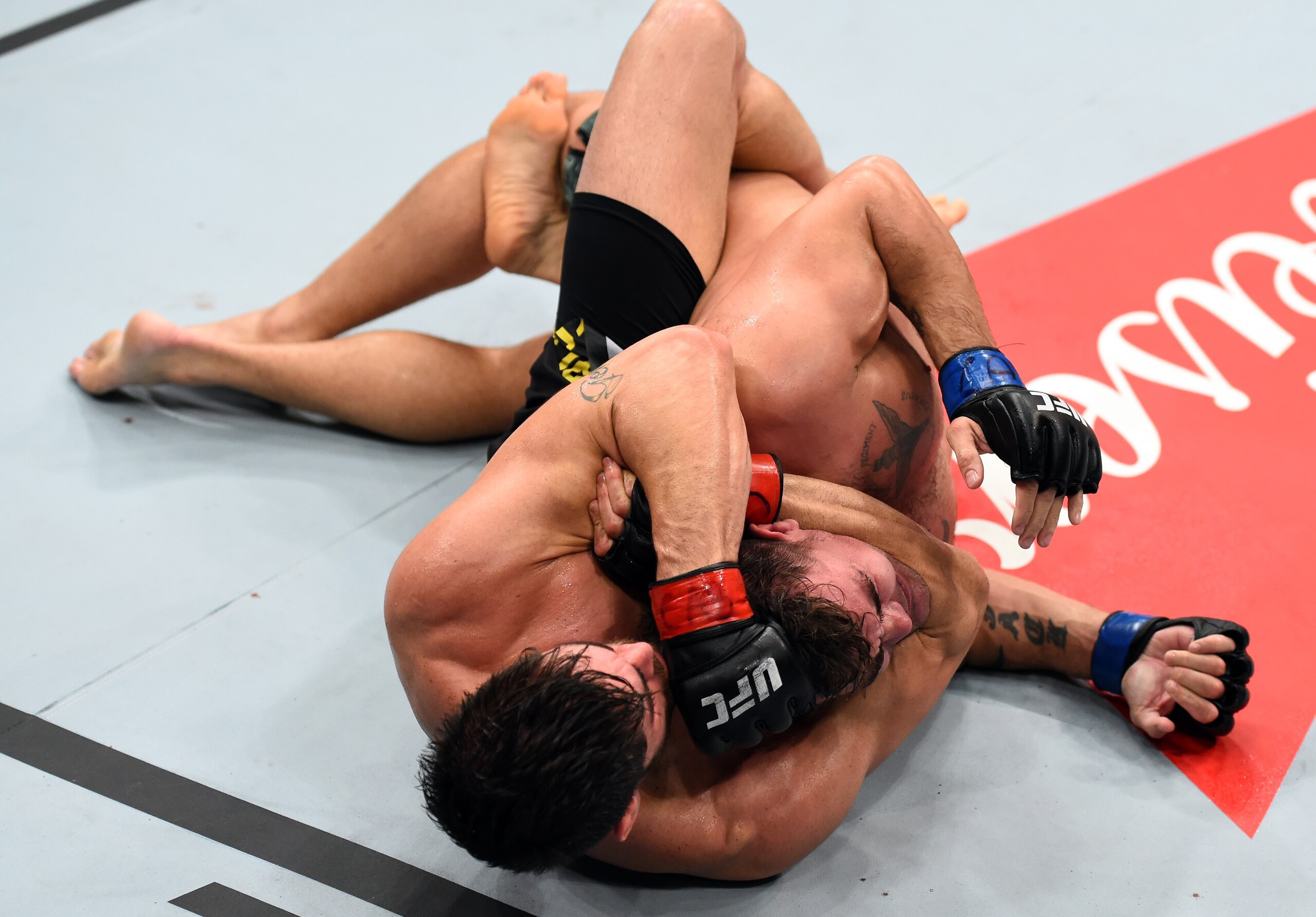 Jack Marshman (right) is in a choke hold.
