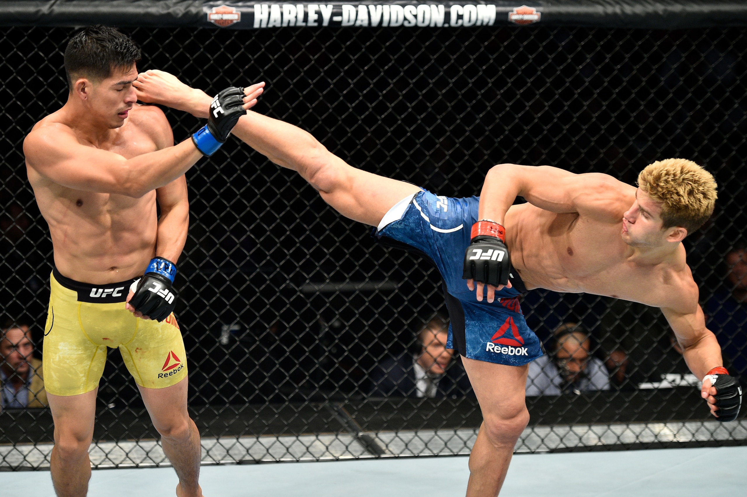 Sage Northcutt (right) kicks Michel Quinones.