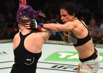 Jessica-Rose Clark (right) punches Bec Rawlings