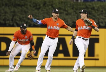 Miami Marlins outfielders Marcell Ozuna, Giancarlo Stanton and Christian Yelich