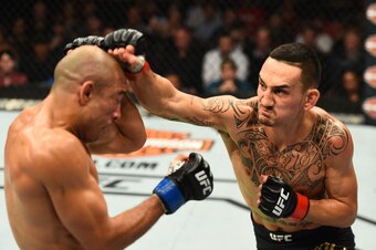 Max Holloway (right) hits Jose Aldo.