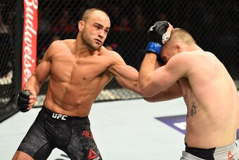 Eddie Alvarez (left) hits Justin Gaethje.